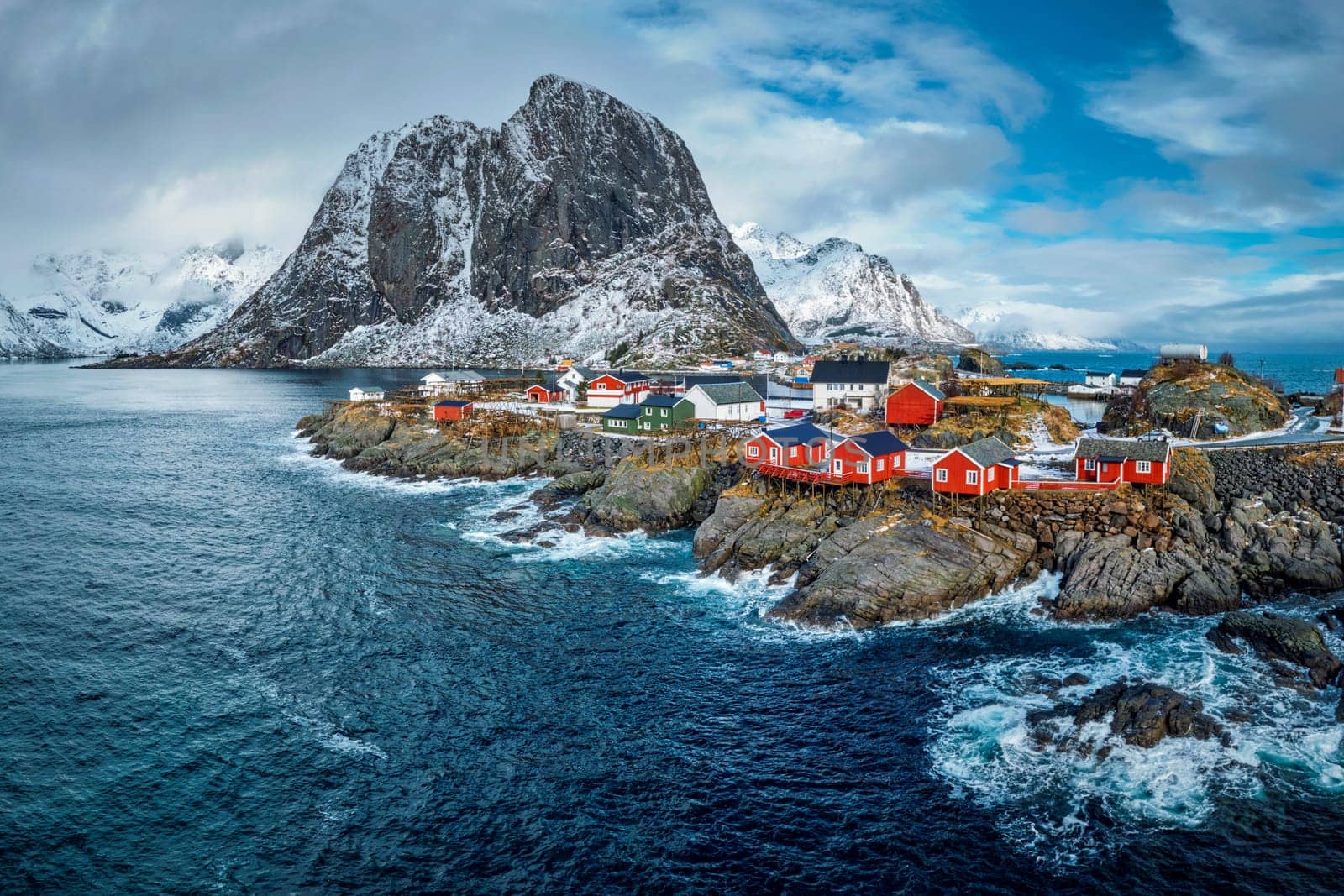 Hamnoy fishing village with red rorbu houses in Norwegian fjord in winter. Lofoten Islands, Norway