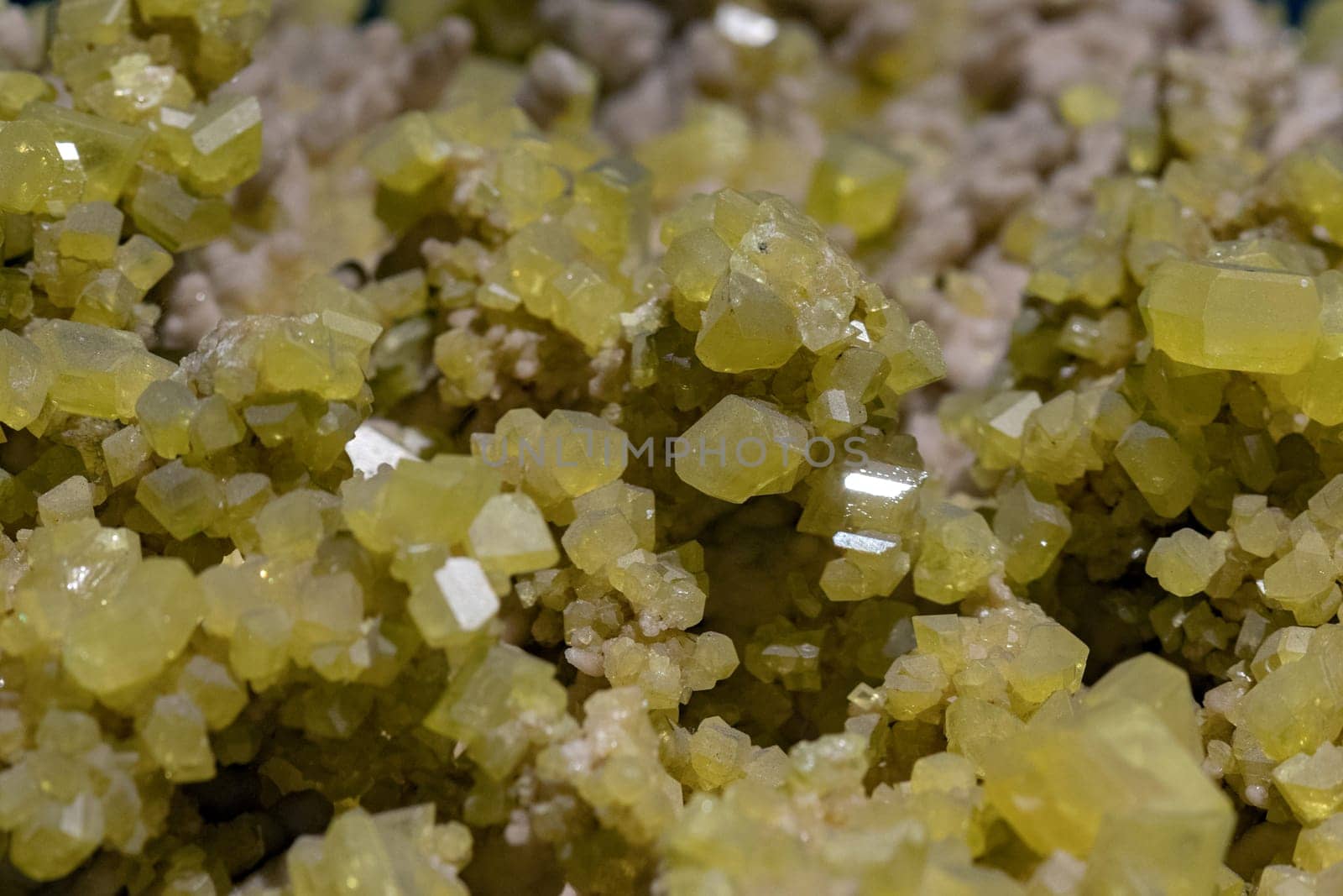 Aragonite rock with yellow sulfur macro