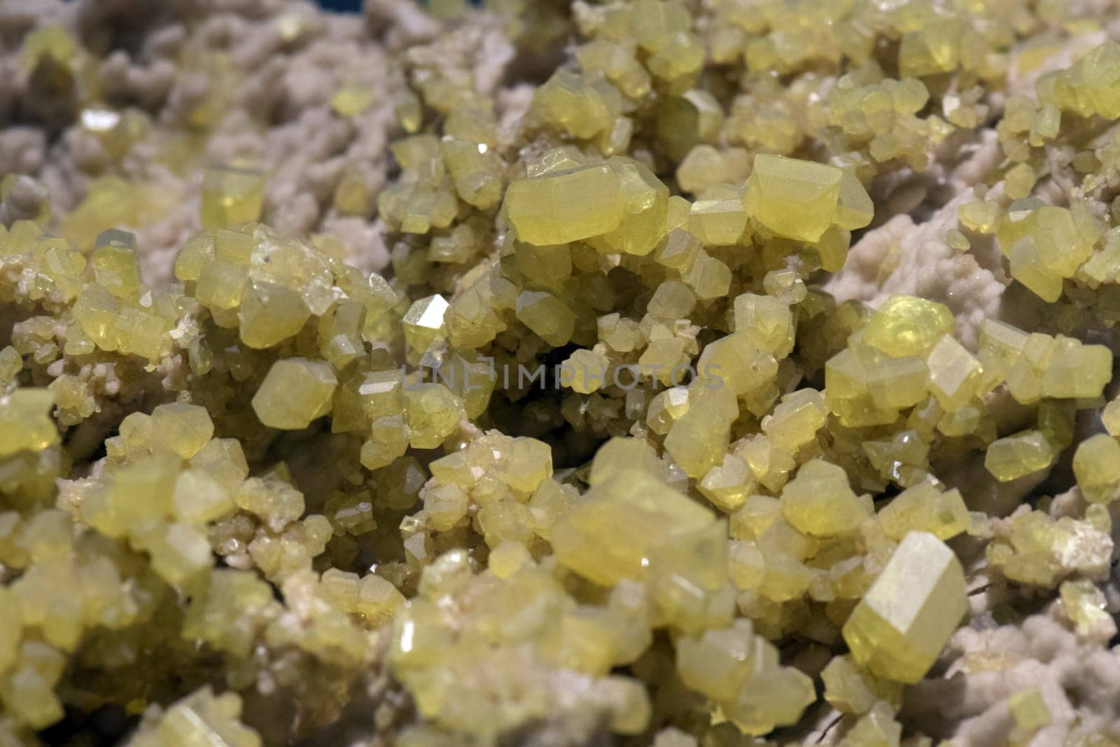 Aragonite rock with yellow sulfur macro