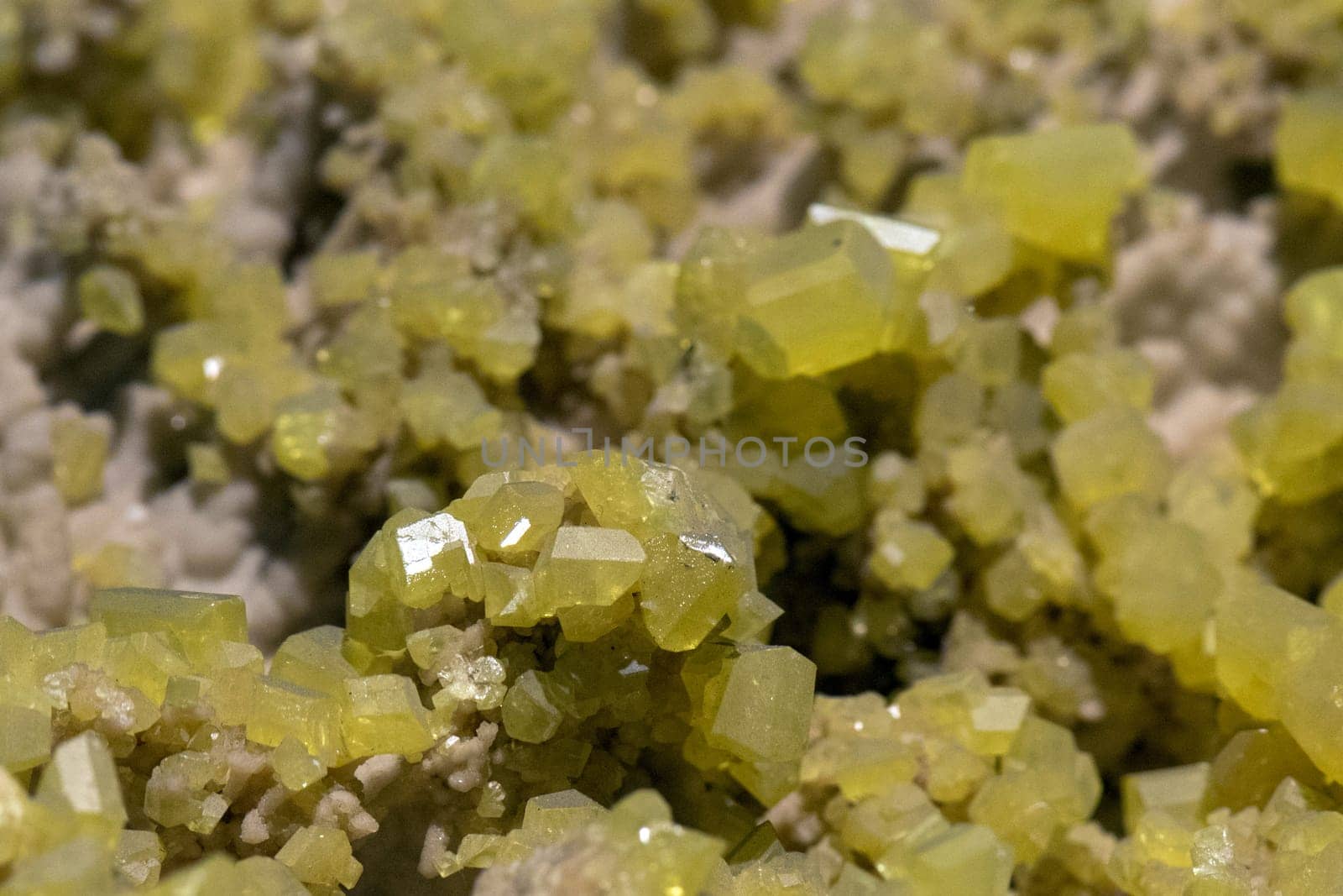 Aragonite rock with yellow sulfur macro