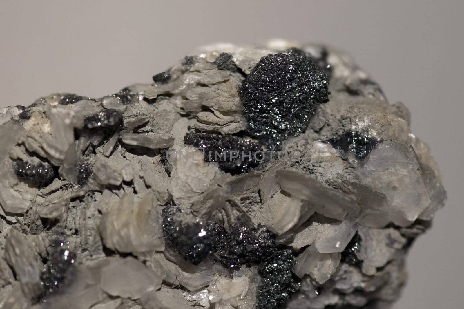 silver ore on rock by AndreaIzzotti