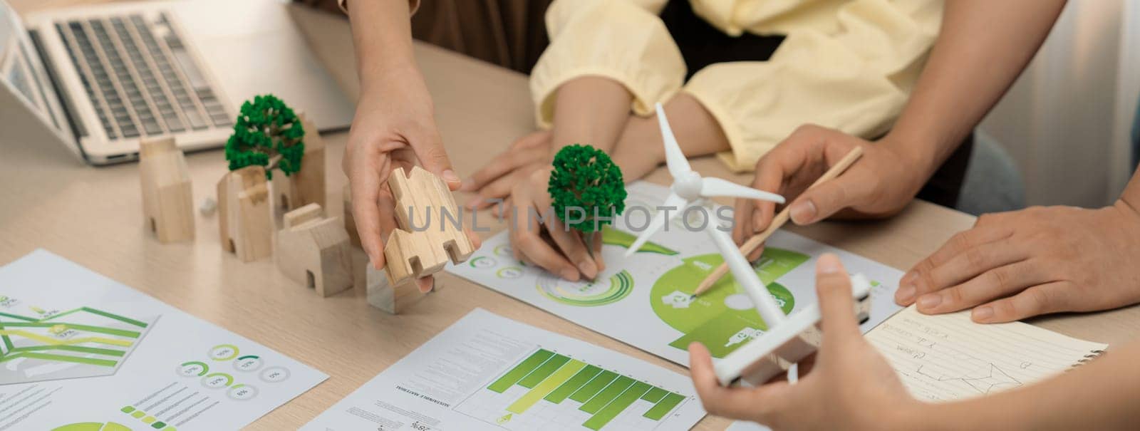 Windmill model placed during presenting green business. Closeup. Delineation. by biancoblue