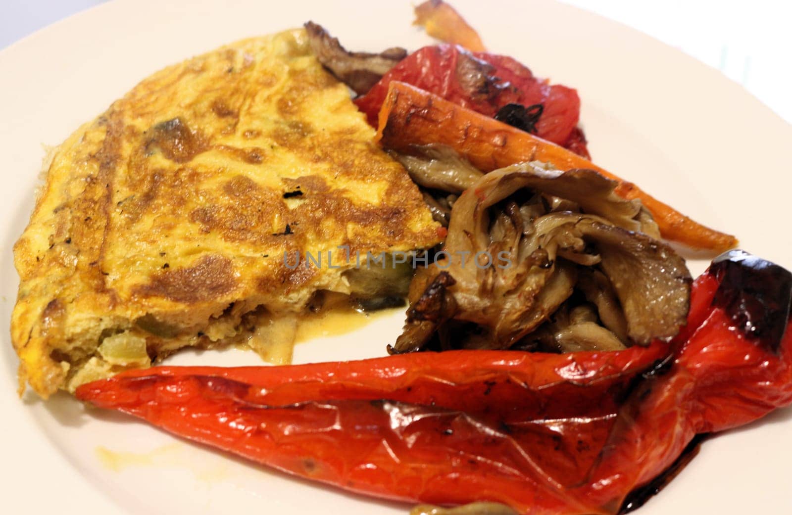 Savor the delightful combination of oven-roasted veggies paired with a fluffy omelette