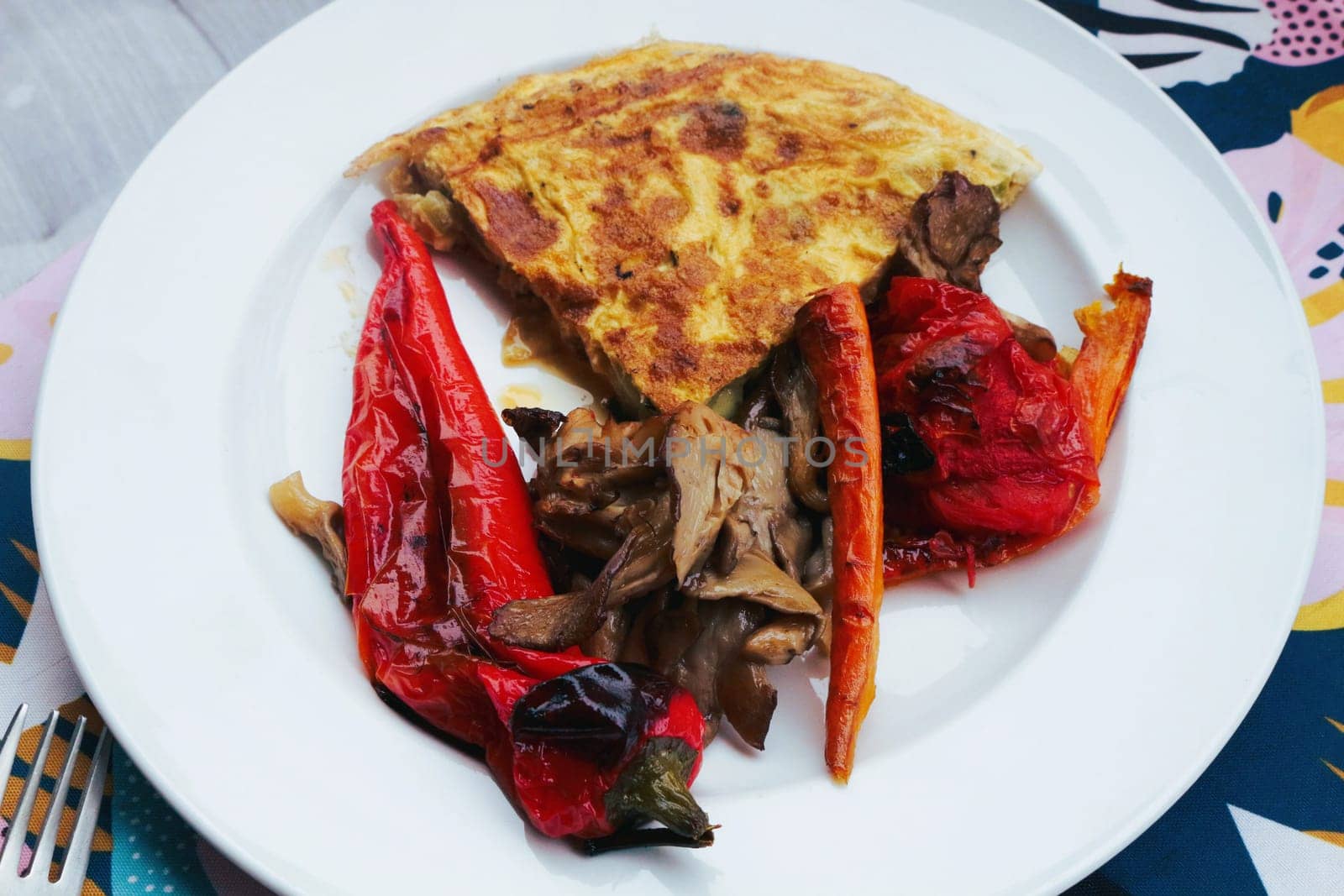 Savor the delightful combination of oven-roasted veggies paired with a fluffy omelette