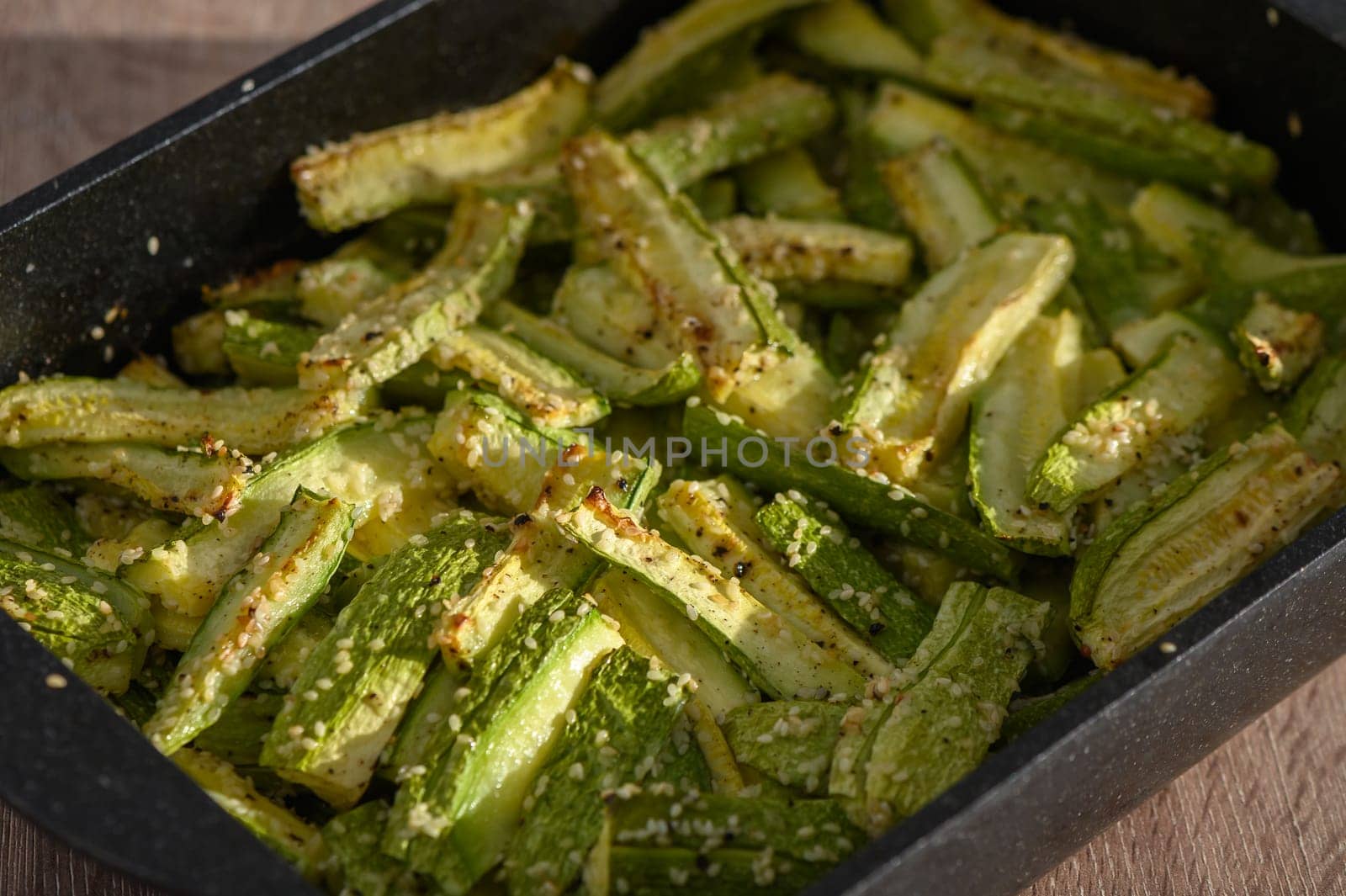 zucchini baked in the oven on a wooden table 2