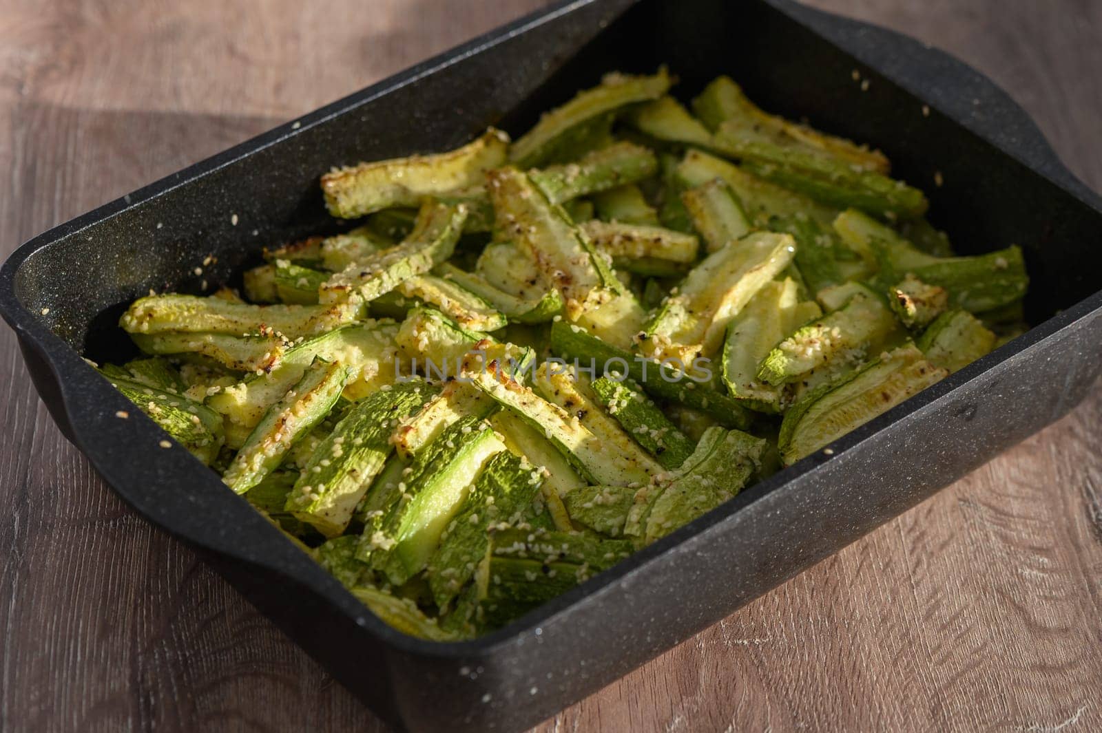 zucchini baked in the oven on a wooden table in the kitchen 2