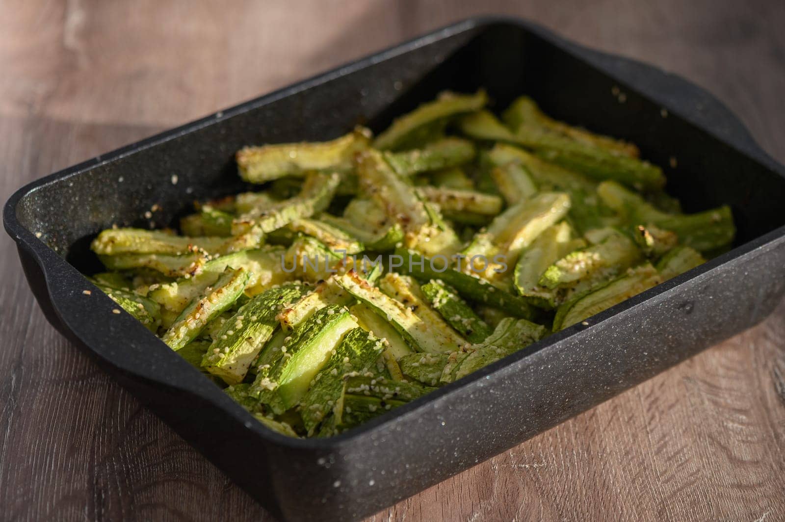 zucchini baked in the oven on a wooden table in the kitchen 3