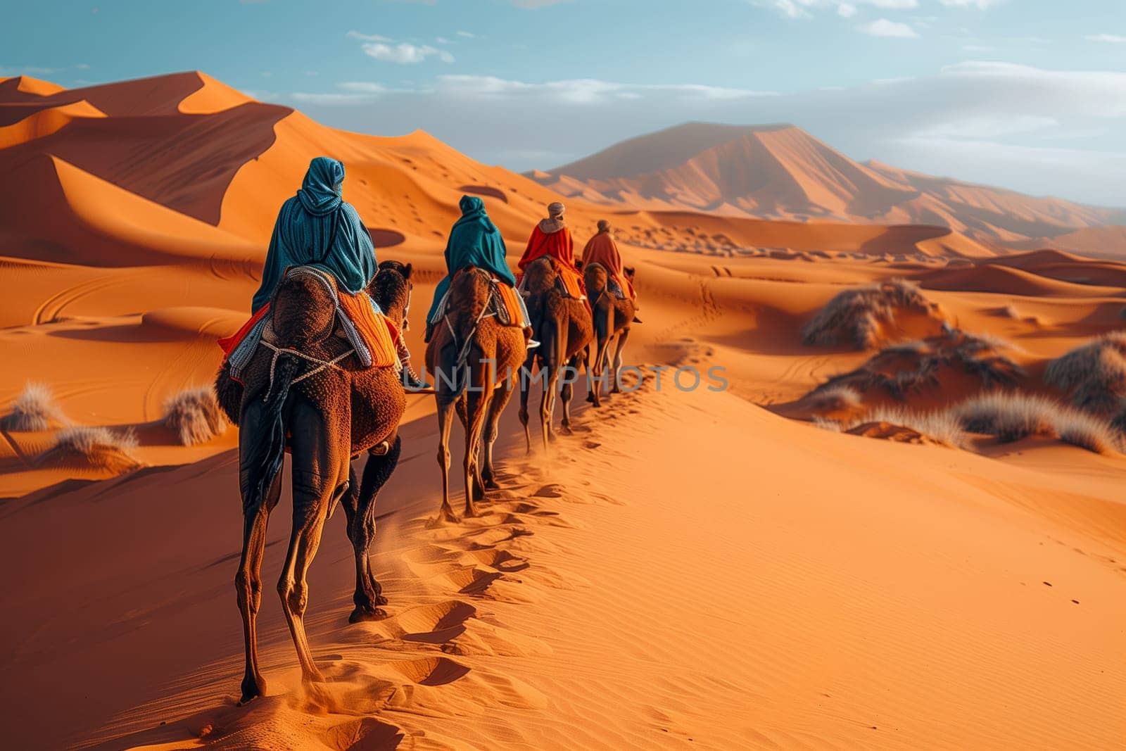 A group of travelers is journeying through the desert landscape on camels, with the vast sky above and rugged mountains in the distance