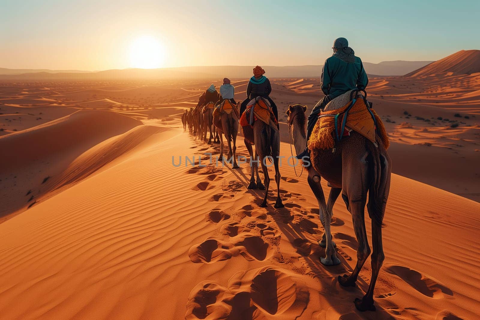 A group of travelers are journeying through the aeolian landscape on camels at sunset, admiring the natural environment and vast sandy horizon