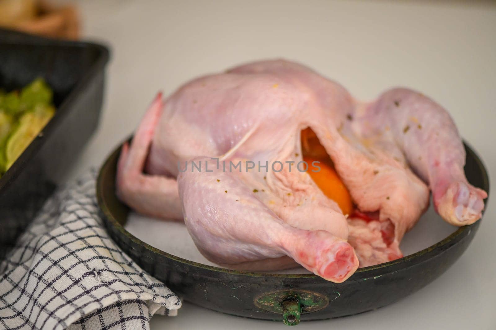Still life full length raw chicken for roasting preparation