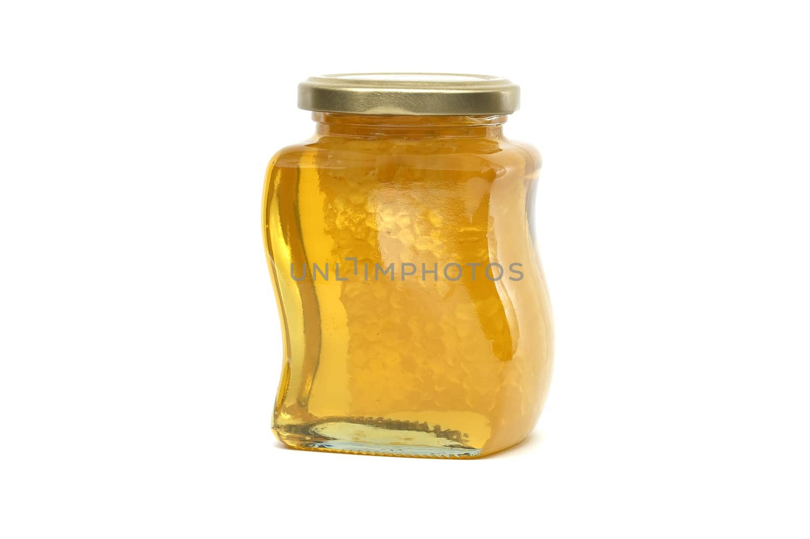 Glass jar filled with honey and honeycomb isolated on white by NetPix