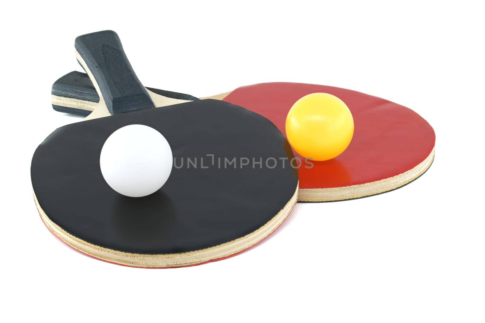 Table tennis rackets and two balls isolated on white by NetPix