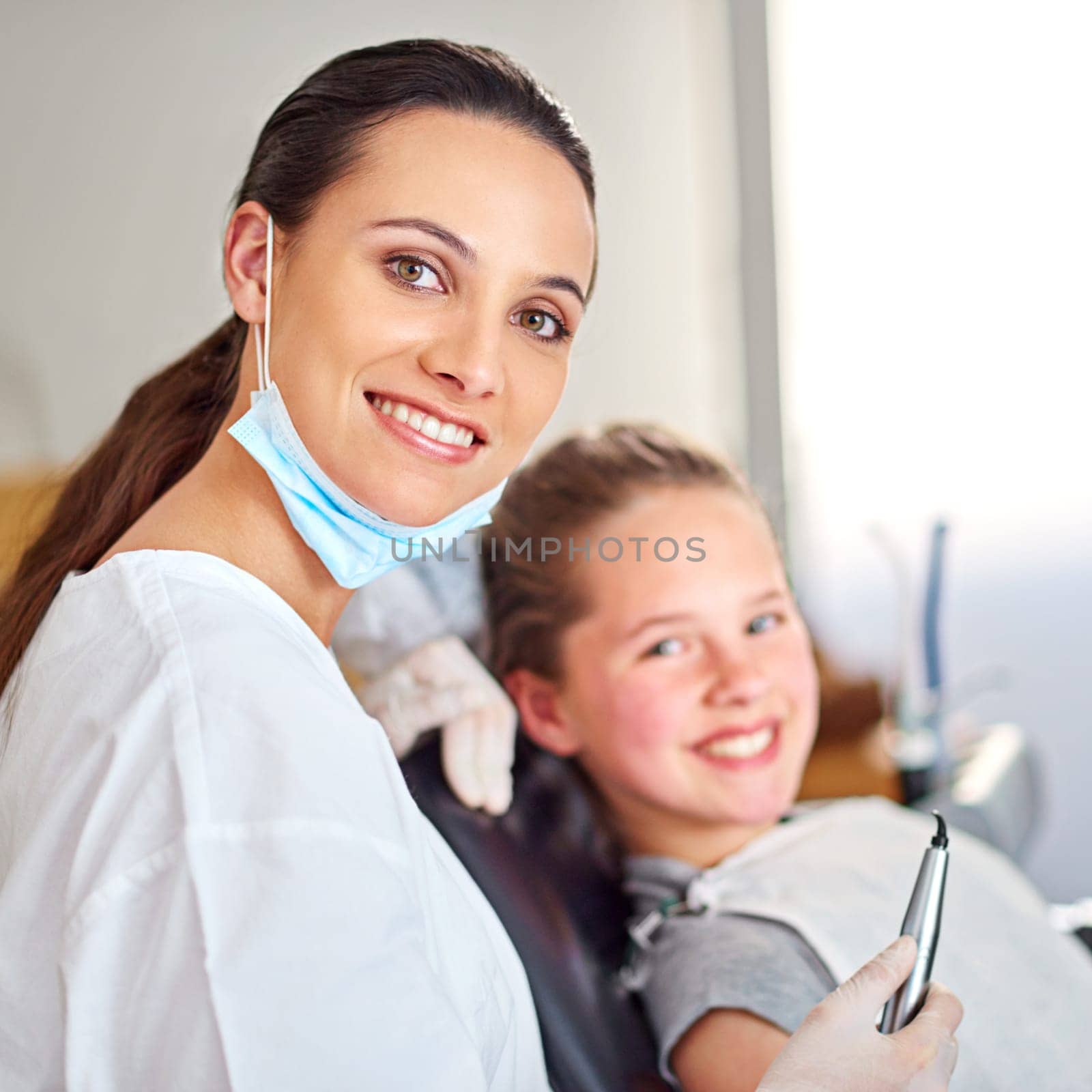 Portrait, dentist and woman with tools for happy child in medical exam, orthodontics or cleaning teeth. Face, smile and dental doctor with kid for tooth care, oral health or pediatrician with laser by YuriArcurs