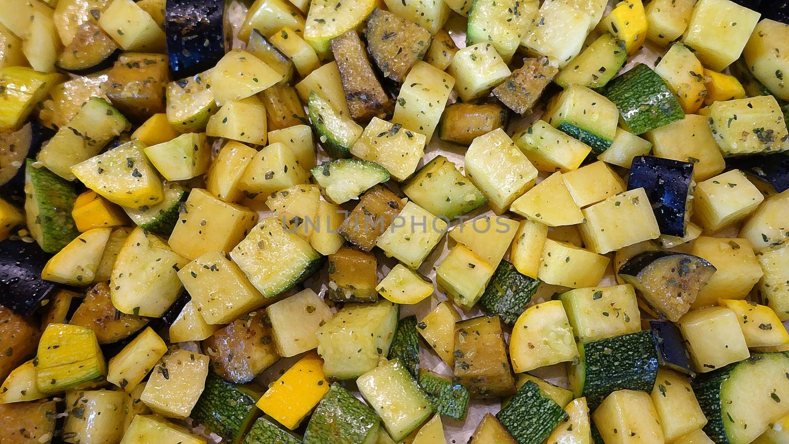 The eggplant and zucchini are diced, spiced and ready to go in the oven.