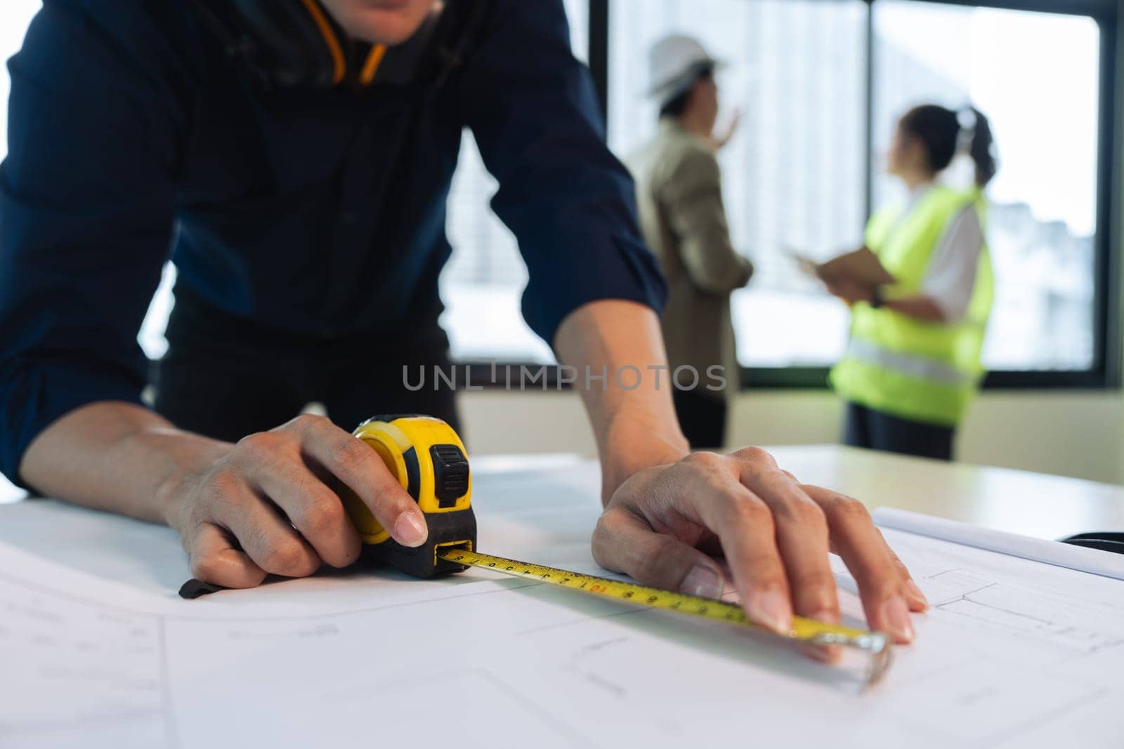 Group of engineer is discussion and brainstorming about condominium model of construction project.