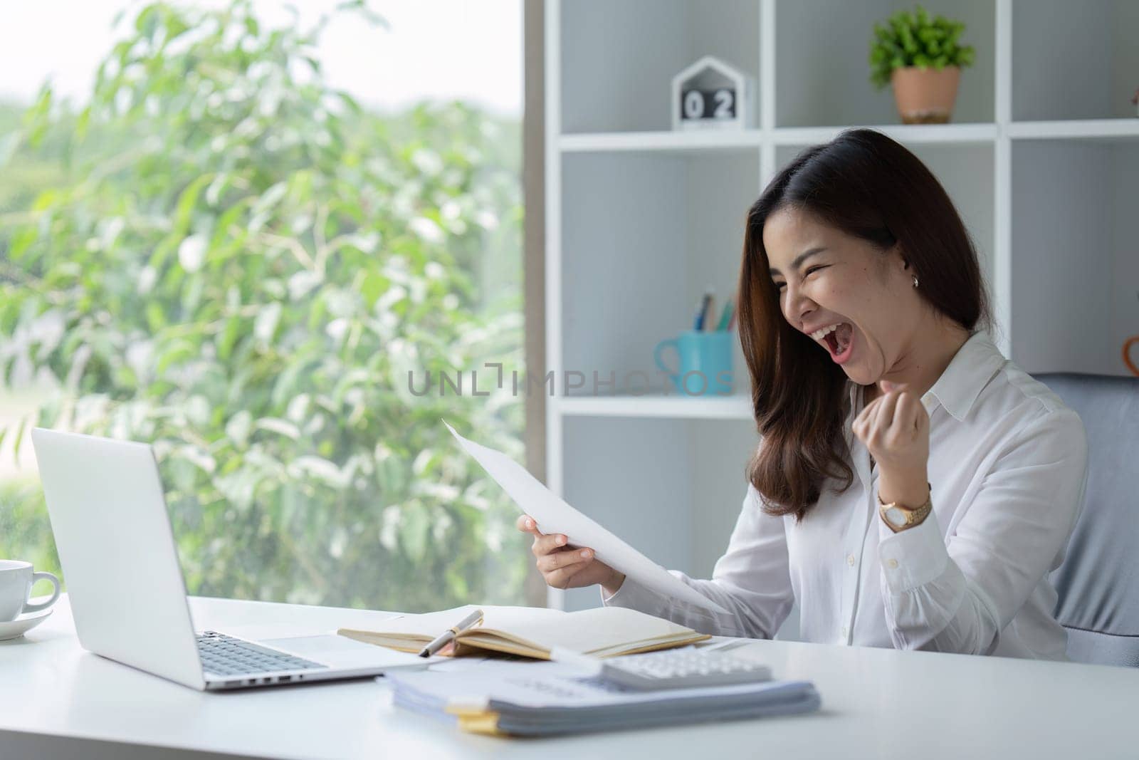 Excited businesswoman feels happy celebrating success promotion result.