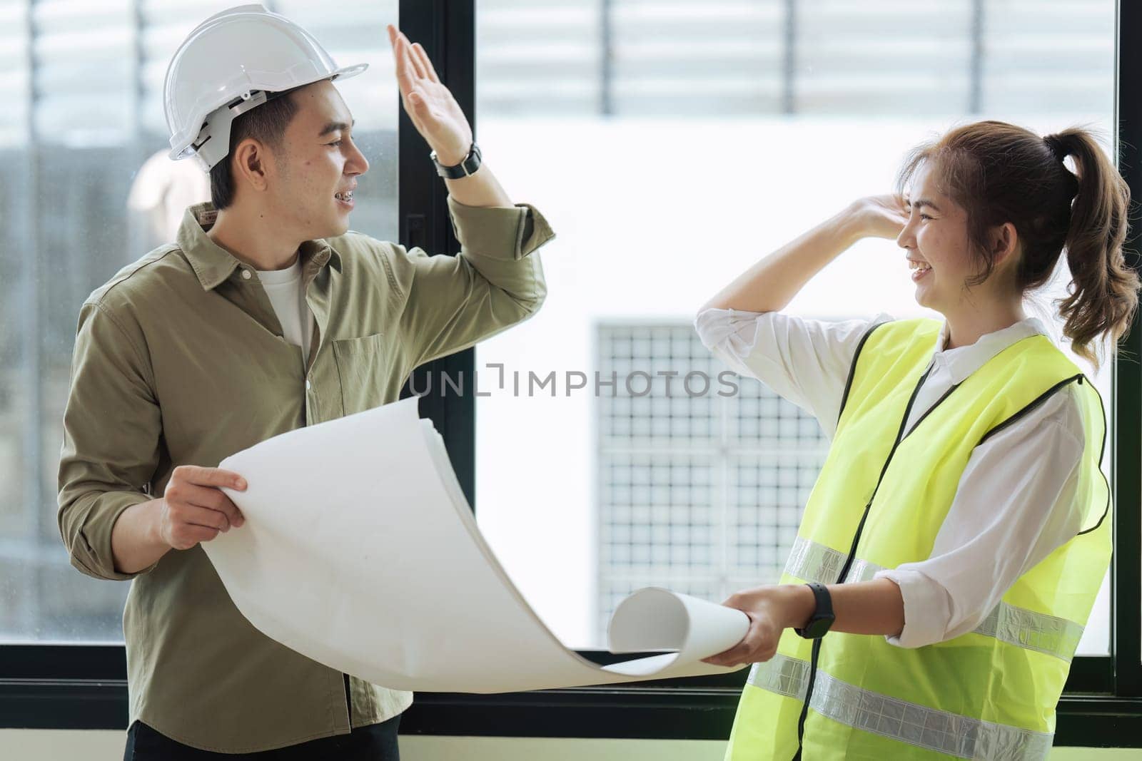 engineer teamwork and architect working and high five for successful job at construction site by itchaznong