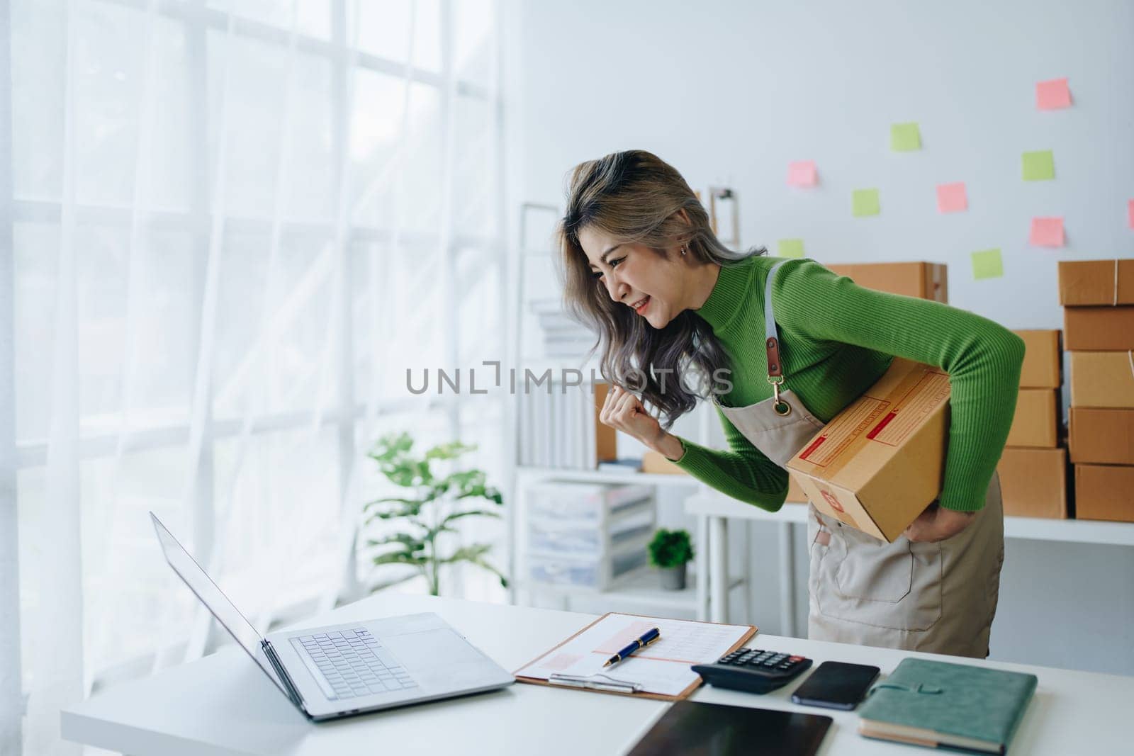 Portrait Of Asian Female Owner Of Fashion Store Clothing Store successful happy smile at small business, sme or ecommerce concepts.