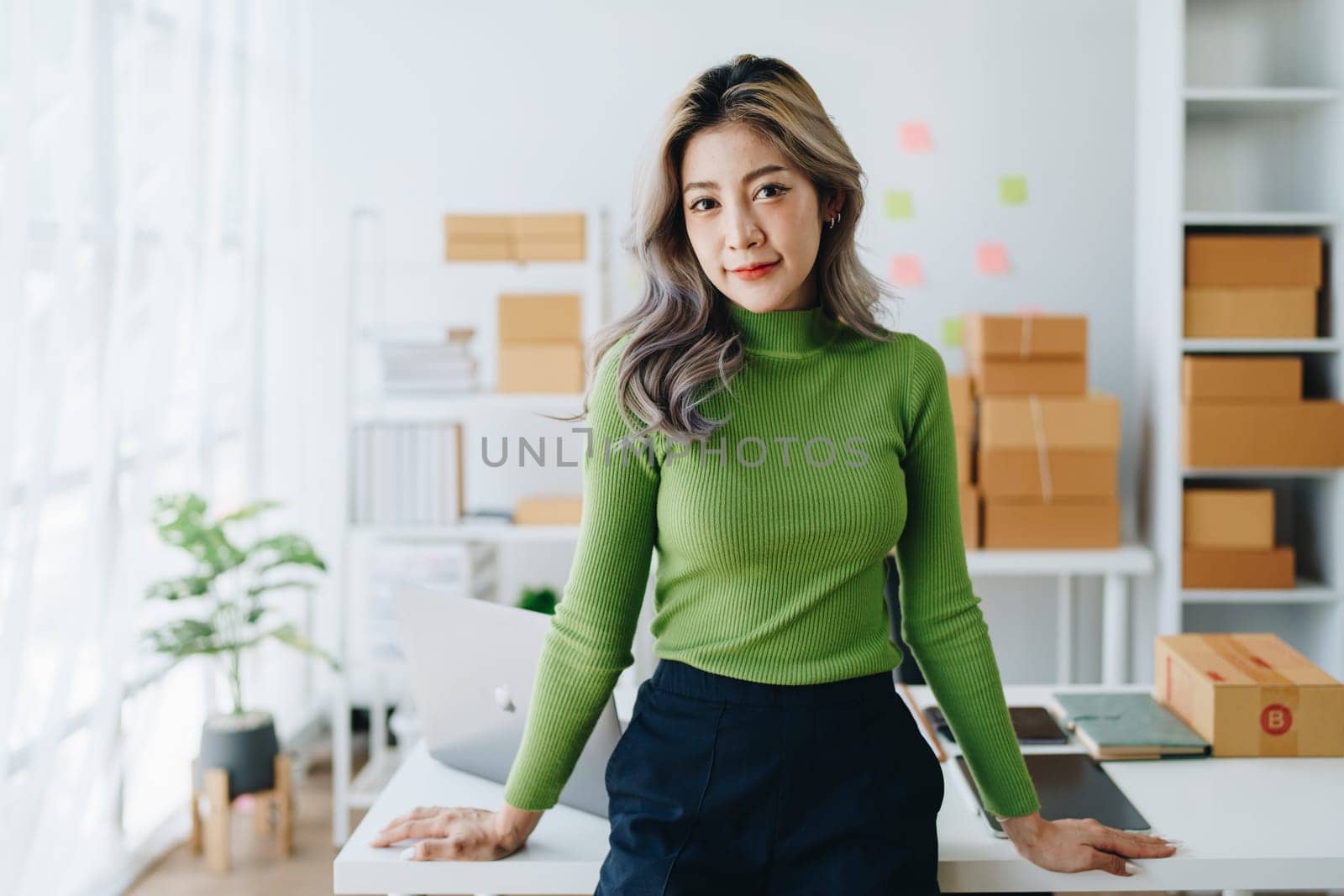 Portrait Of Asian Female Owner Of Fashion Store Clothing Store successful happy smile at small business, sme or ecommerce concepts by Manastrong