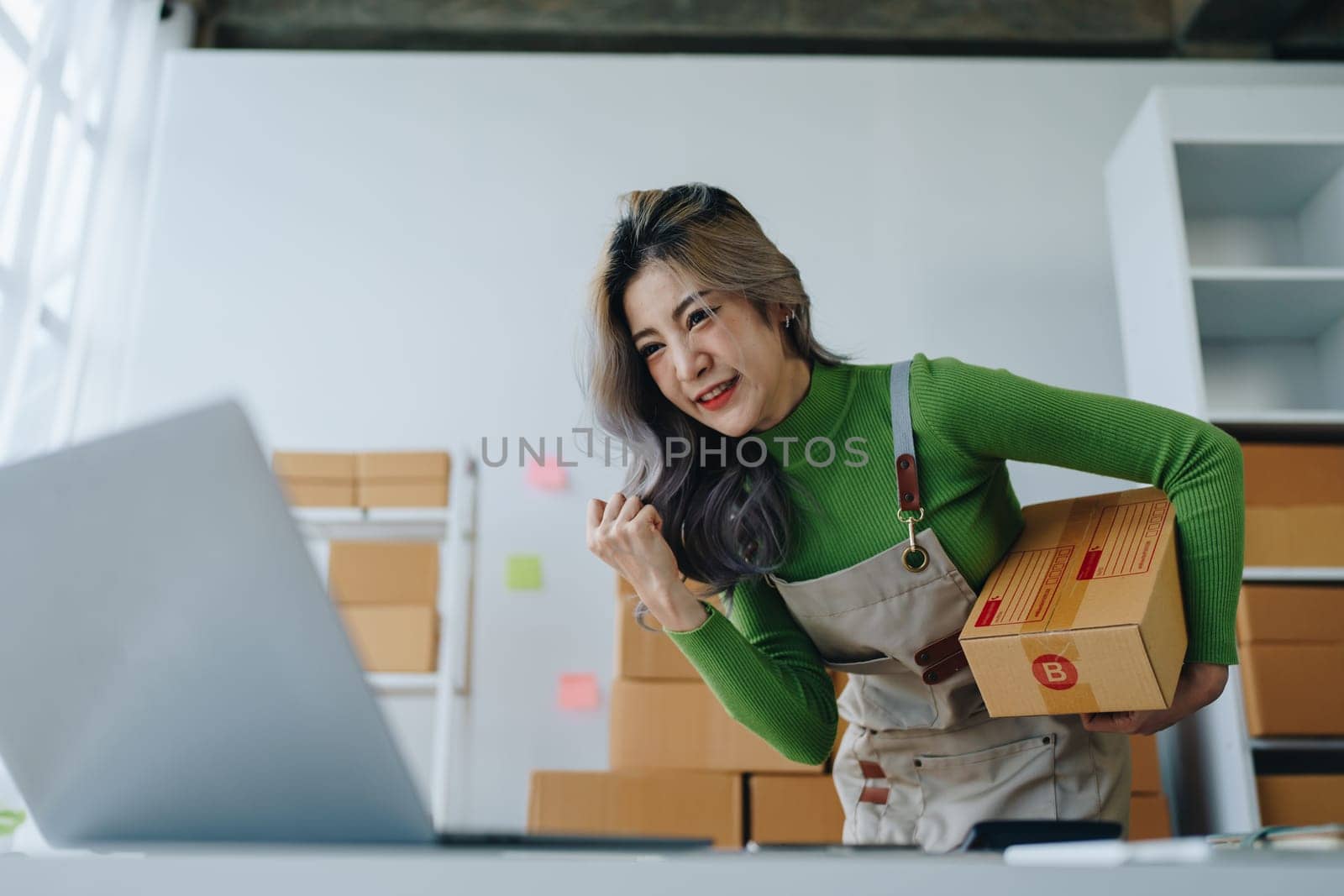 Portrait Of Asian Female Owner Of Fashion Store Clothing Store successful happy smile at small business, sme or ecommerce concepts.