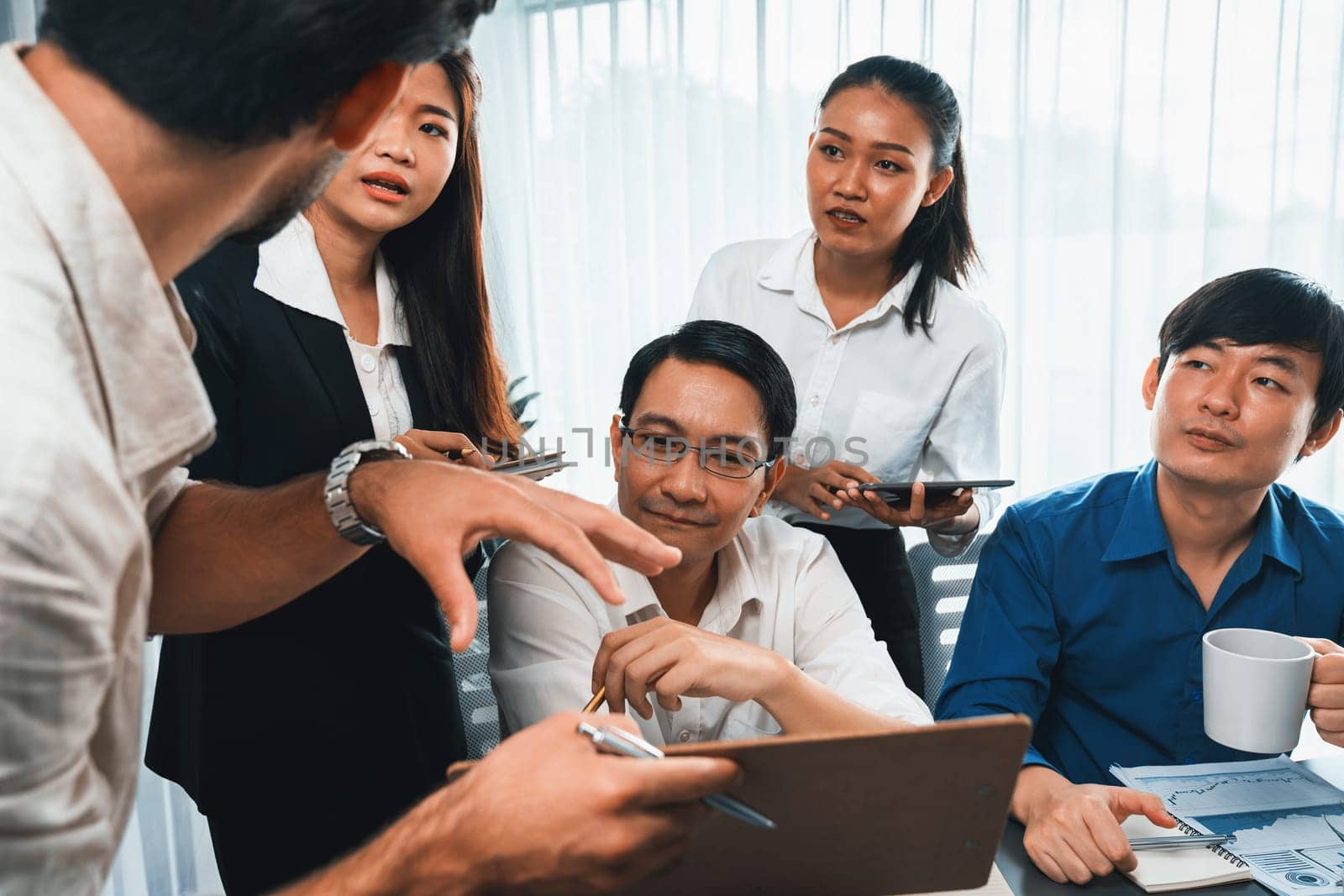 Group of diverse office worker employee working together on strategic business marketing planning in corporate office room. Positive teamwork in business workplace concept. Prudent