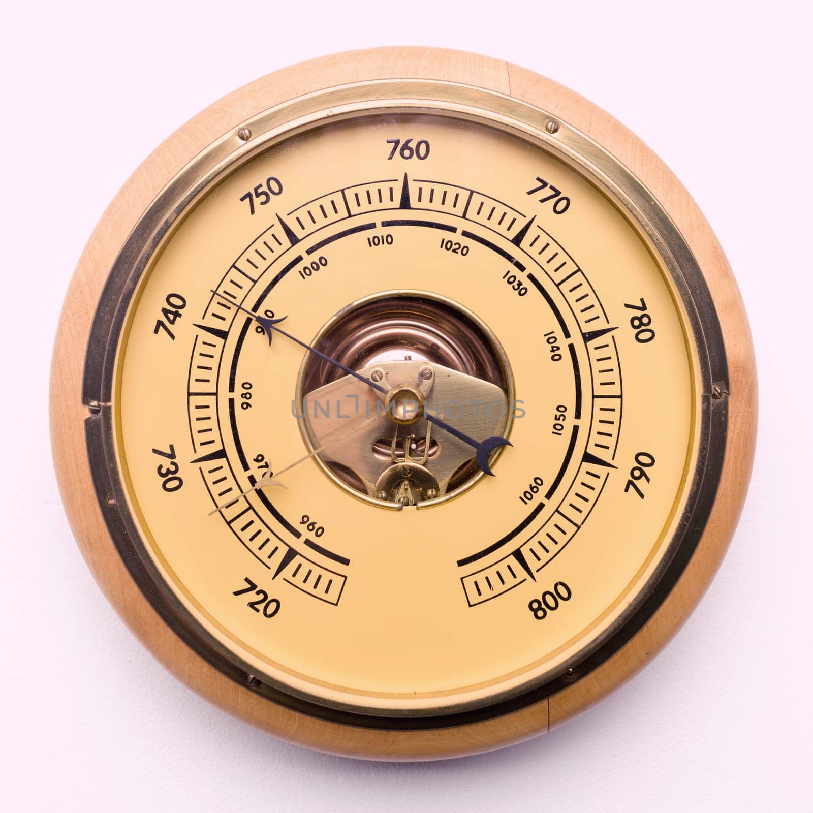 Vintage style barometer isolated on white wall background -