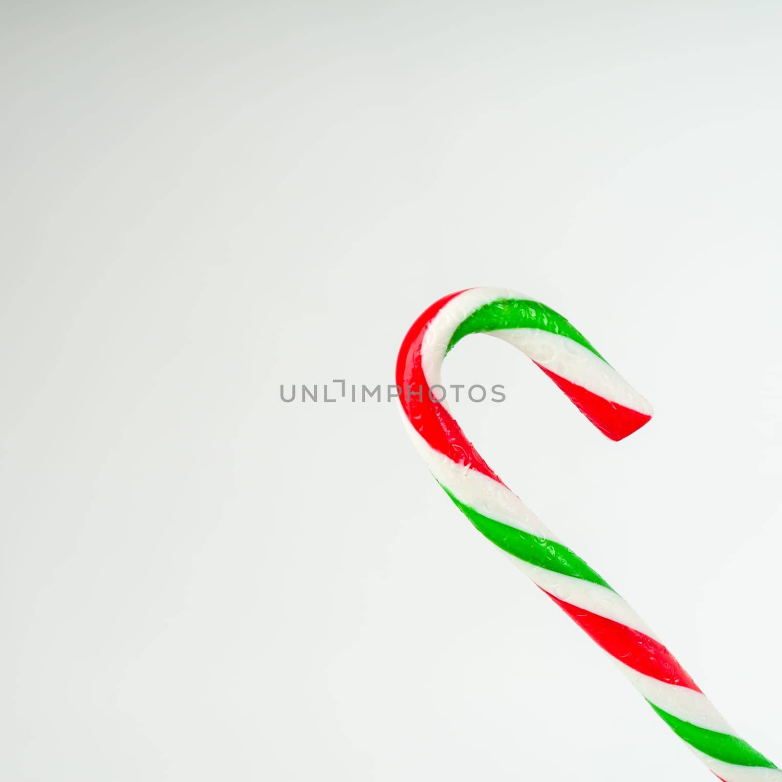 Close up of candy cane isolated on white background by zartarn