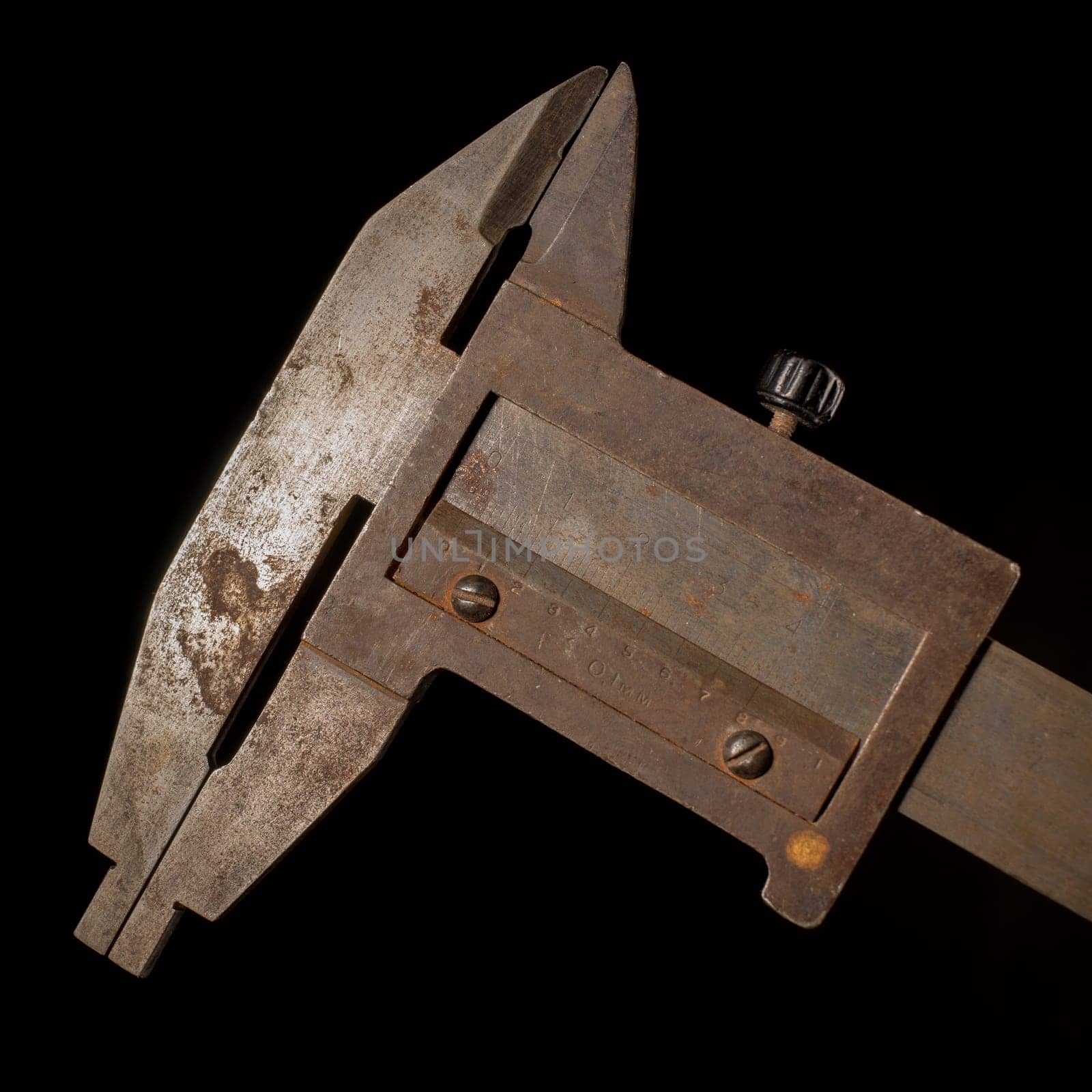 Old tools in front of a black background