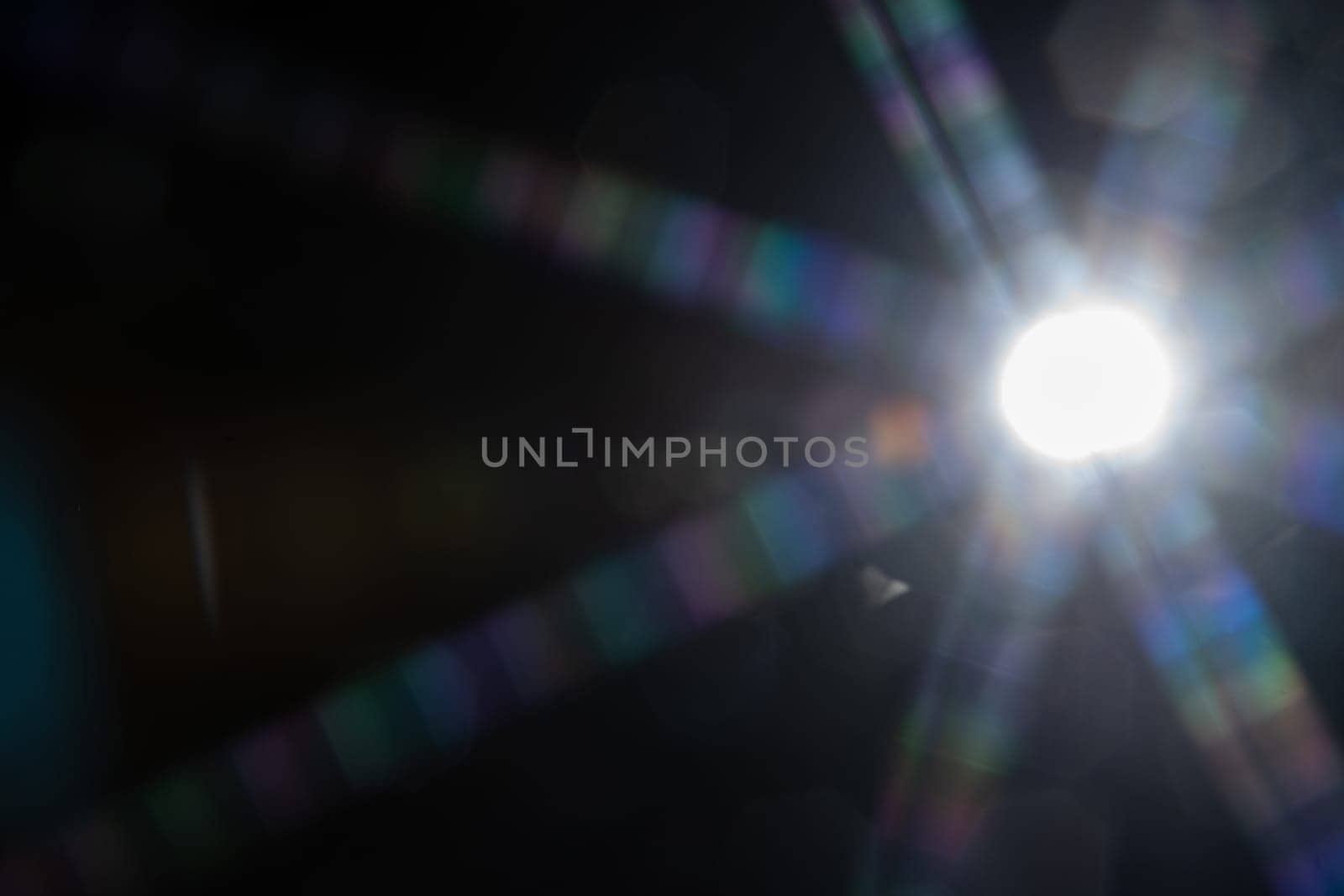 Abstract sun flare. The lens flare is subject to digital correction by zartarn