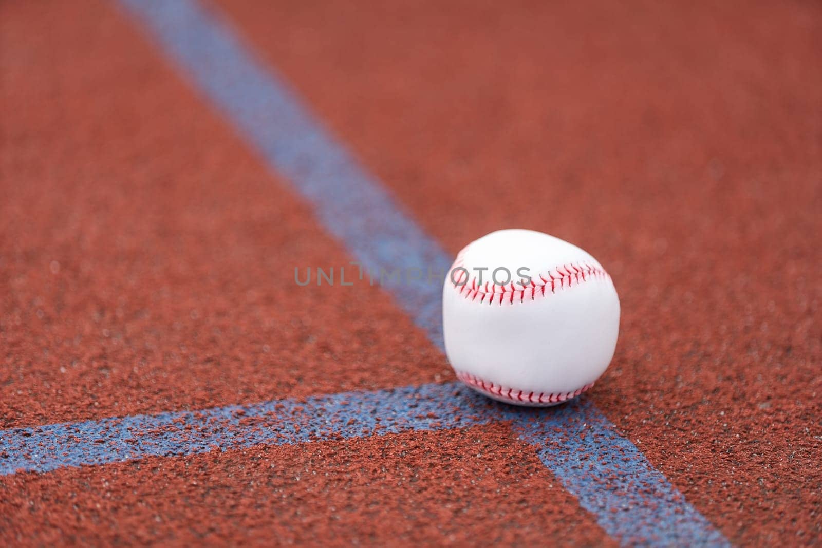 one baseball on infield of sport field by Andelov13