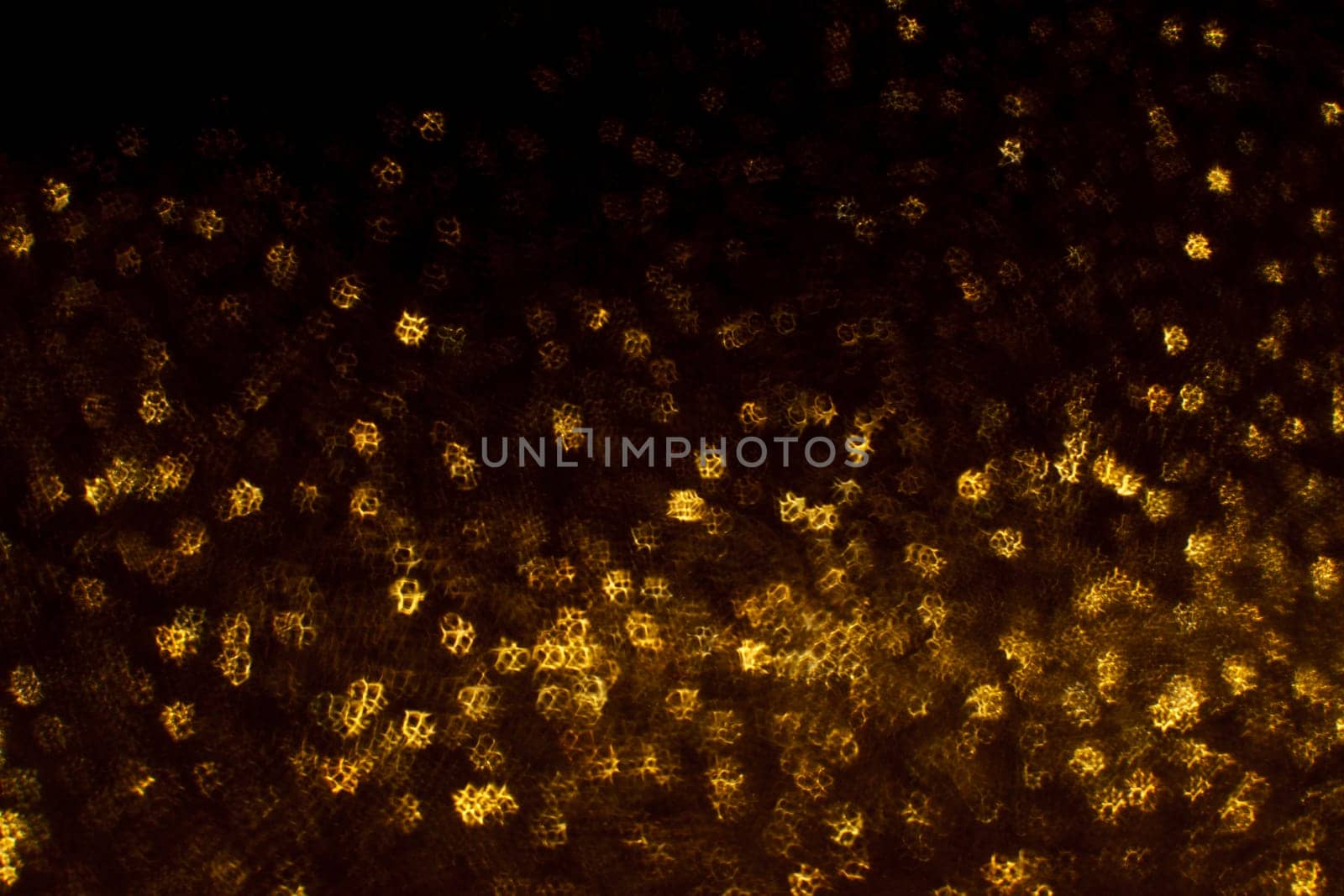 Christmas background. Festive abstract background with bokeh defocused lights and stars.