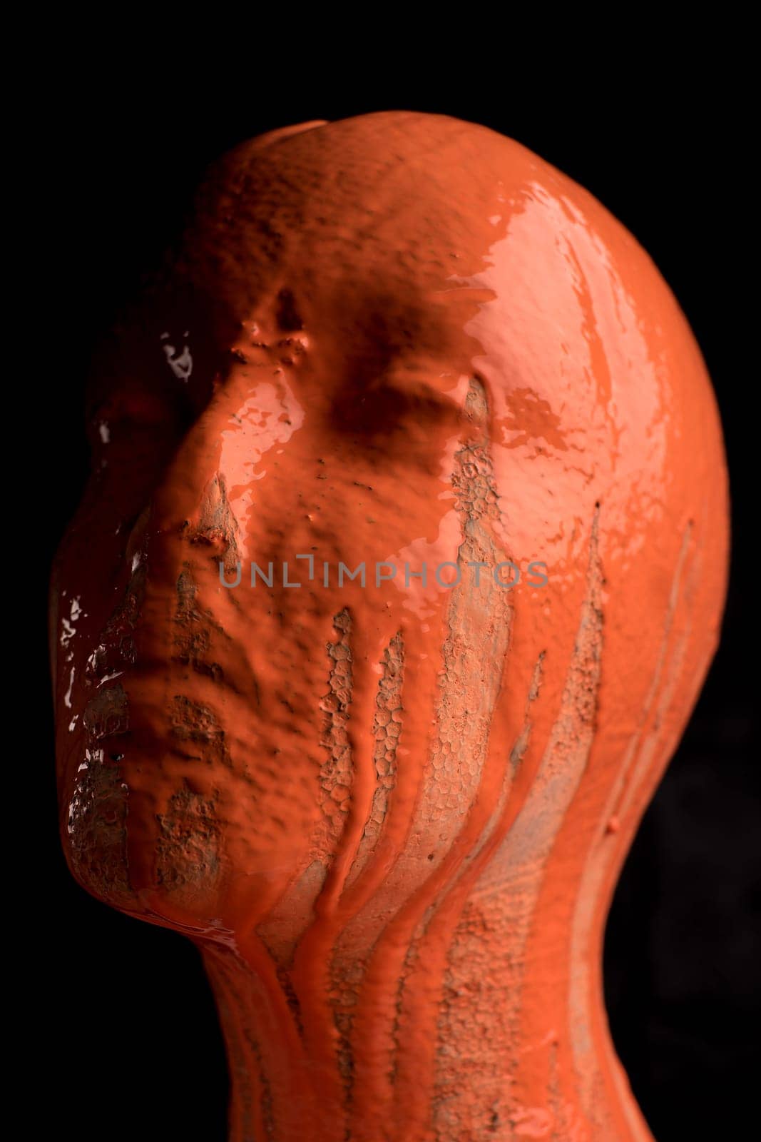 The head of a female mannequin is doused with paint. Brain tumor and disease concept, alzheimer's disease or schizophrenia