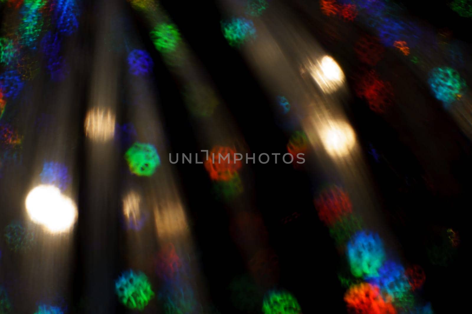Christmas background. Festive abstract background with bokeh defocused lights and stars.