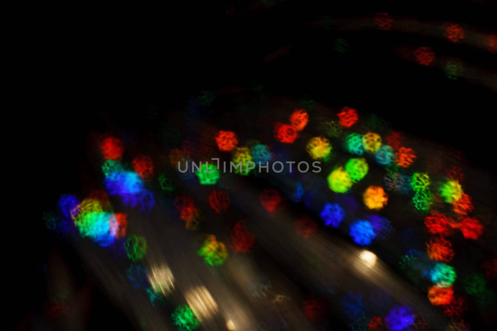 Christmas background. Festive abstract background with bokeh defocused lights and stars by zartarn