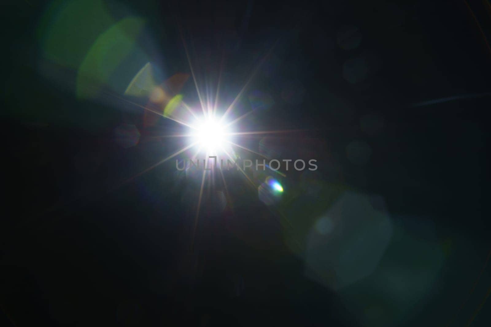 Abstract imitation sun starlight distant galaxy on a black background. -image