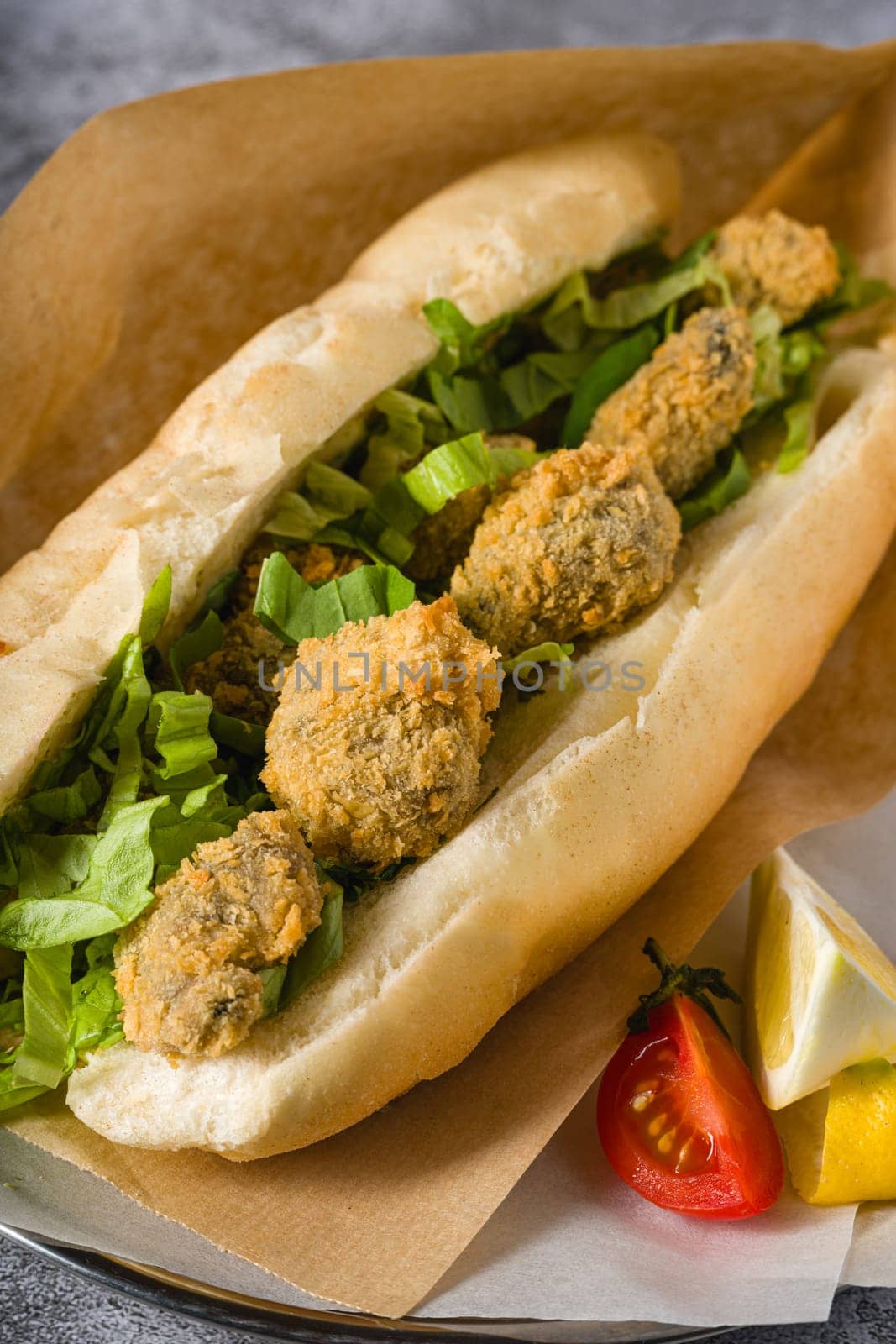 Deep fried mussels in bread and with greens on the side. Turkish name Midye Tava