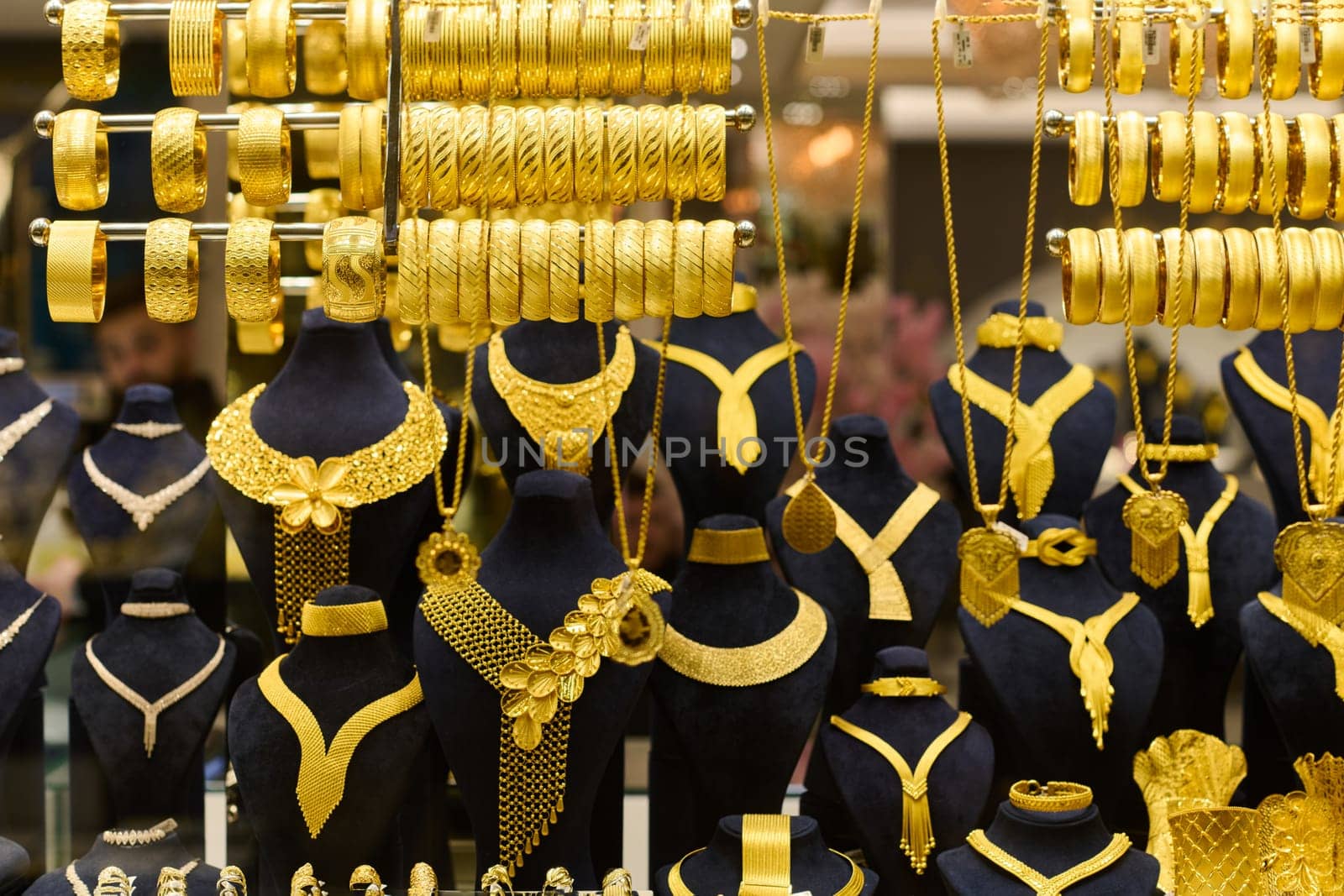 Golden Splendor, Exquisite handcrafted gold jewelry displayed in the bustling streets and traditional workshops of Istanbul.