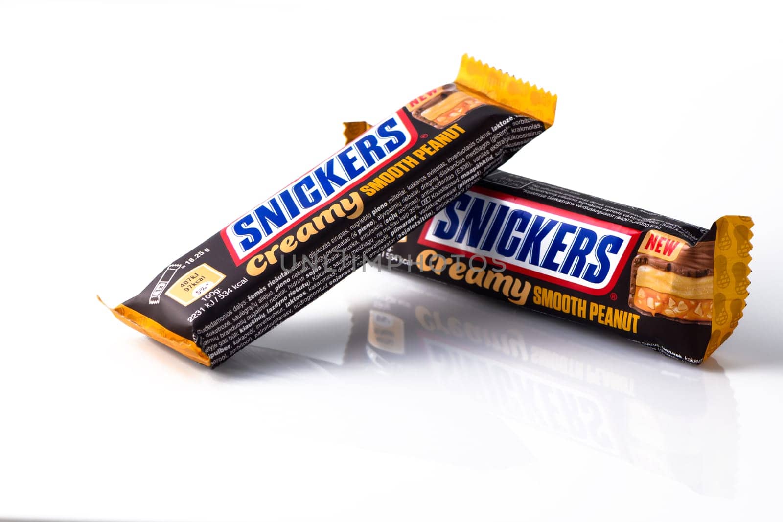 Aizkraukle Latvia 07/07/2023 - two Snickers bars on a white background isolate by Mixa74