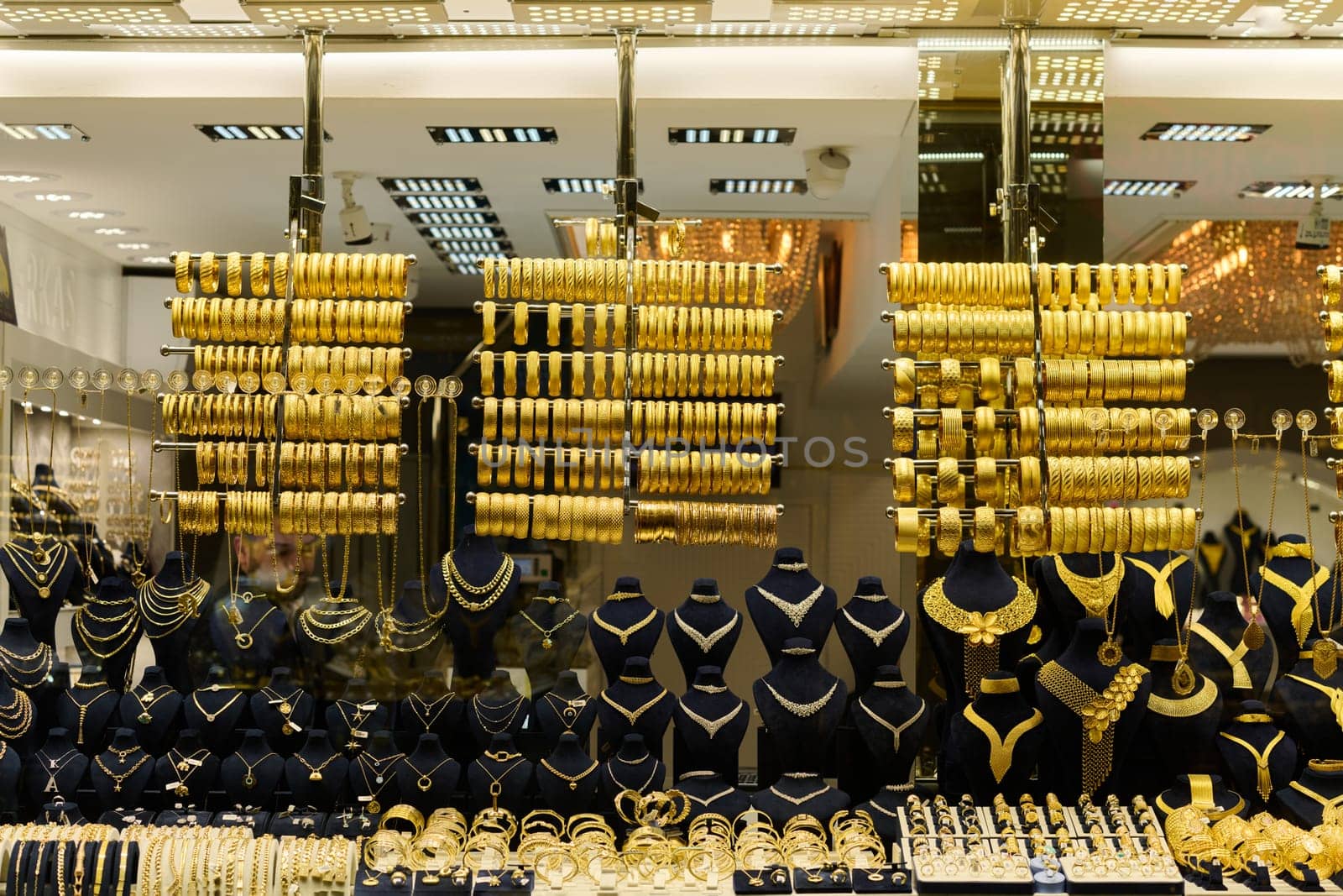 Golden Splendor, Exquisite handcrafted gold jewelry displayed in the bustling streets and traditional workshops of Istanbul.