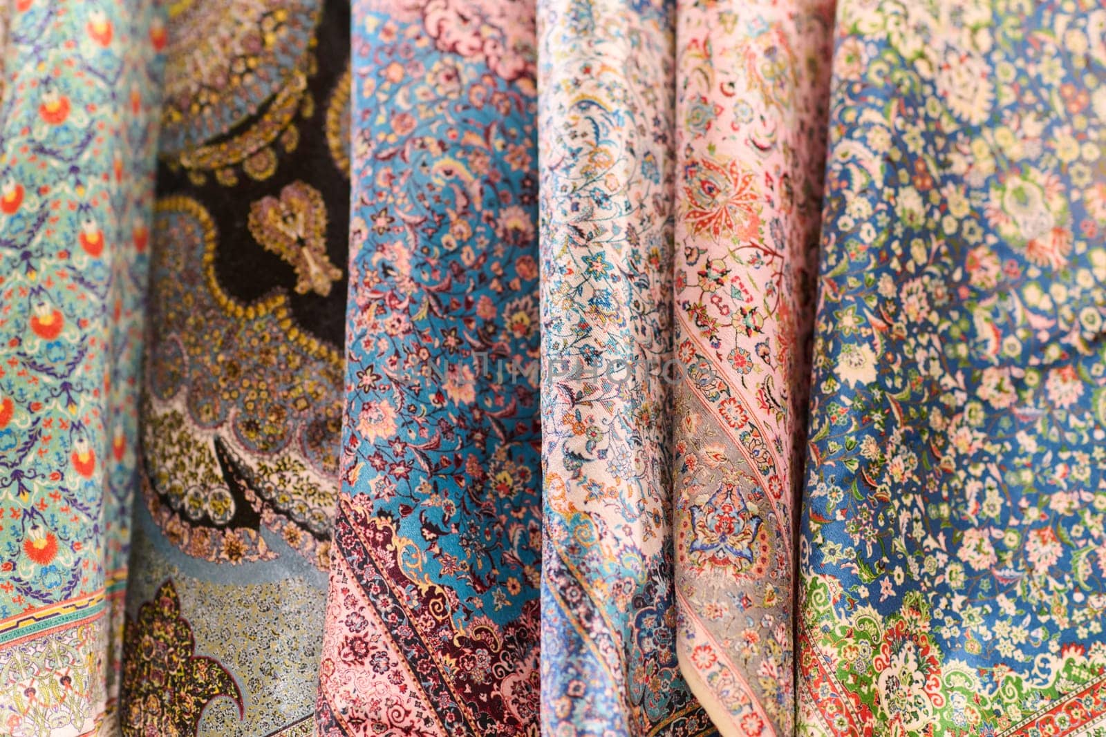 A kaleidoscope of traditional Muslim garments displayed at an Istanbul market reflects the rich cultural heritage of the city.