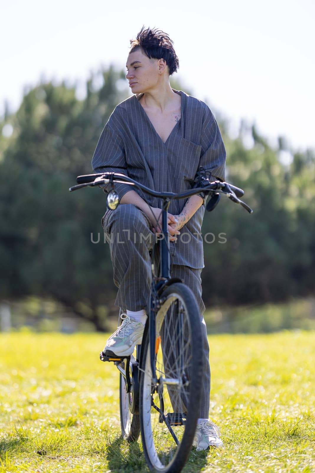 A woman near bicycle in the park, portrait