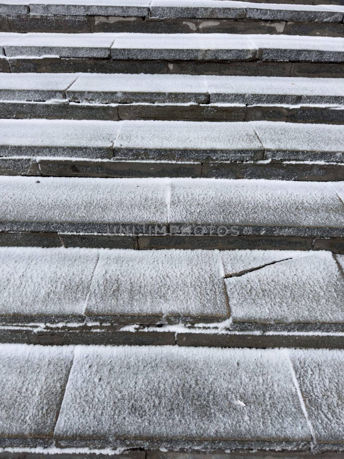 concrete steps covered with snow