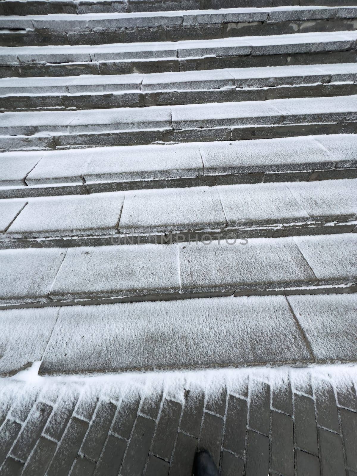 concrete steps covered with snow