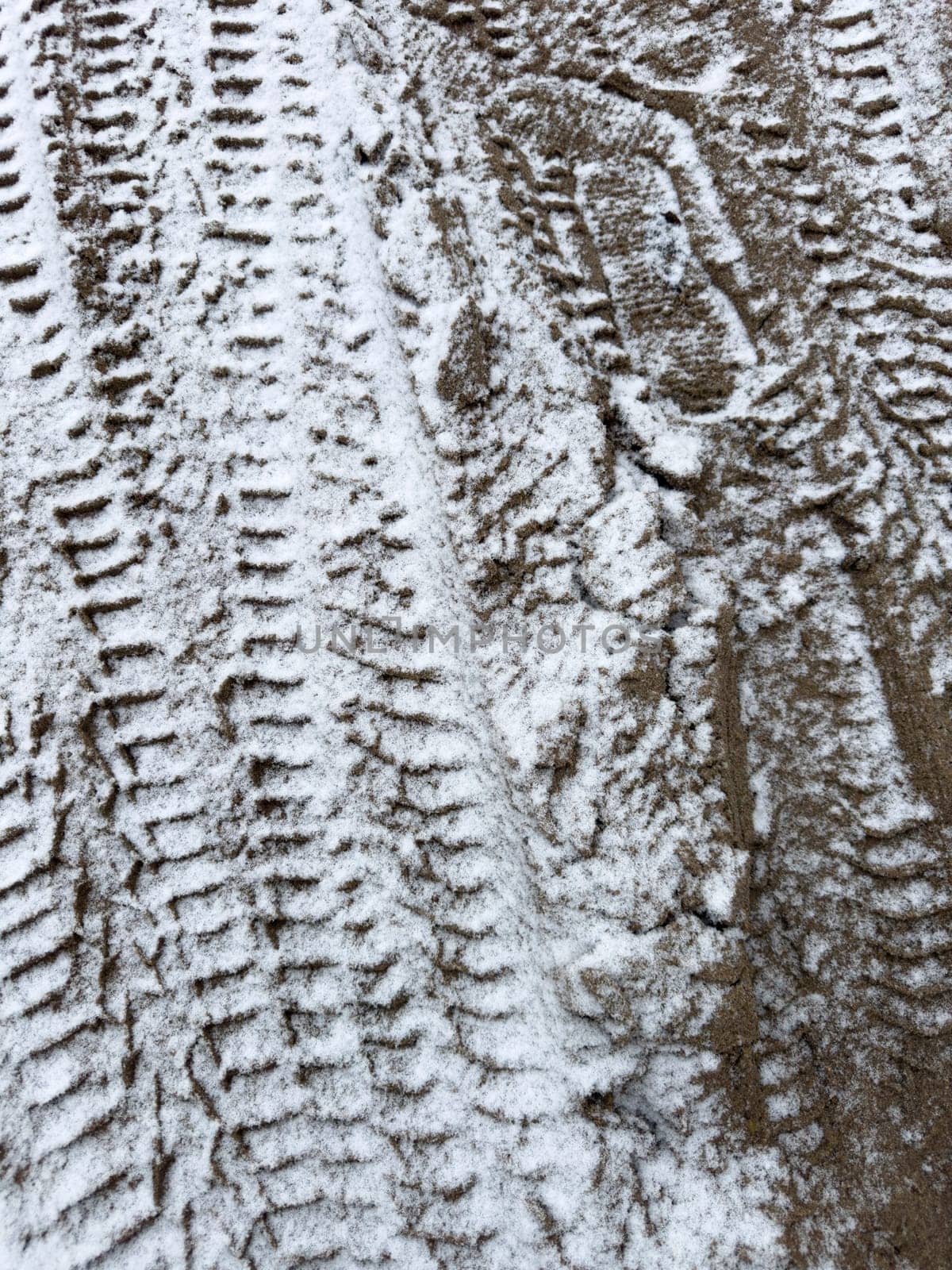 car trail on snowy ground