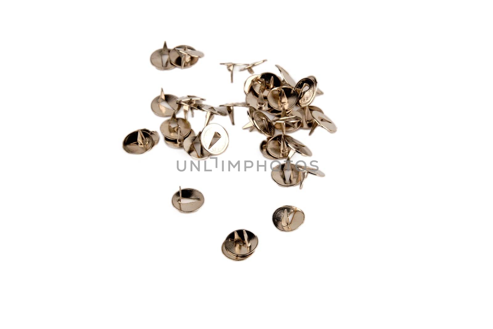 Ordered pile pushpins isolated on white background