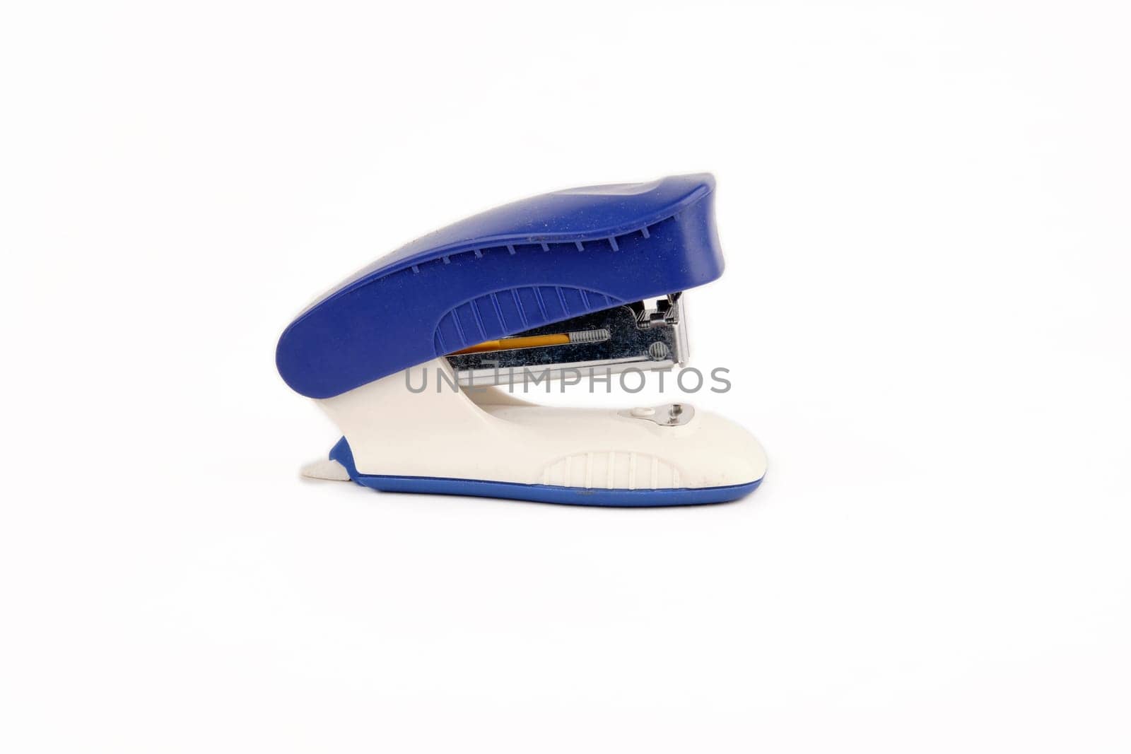 Blue stapler isolated on a white background. Side view
