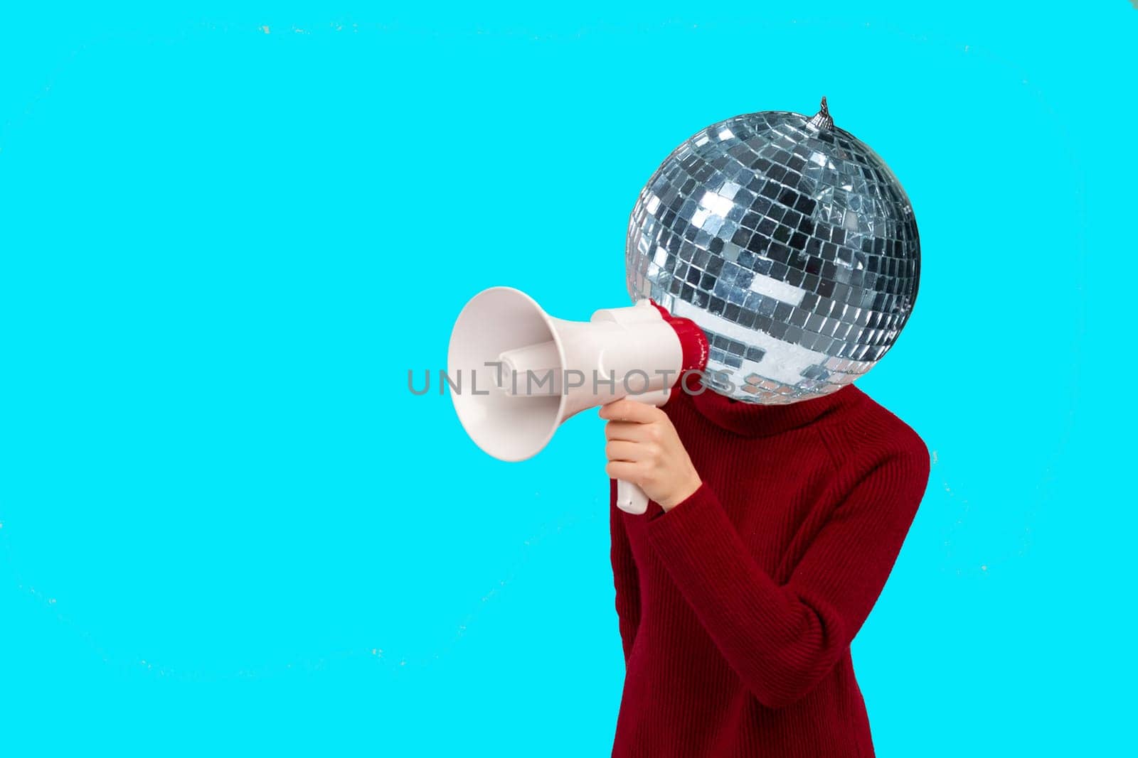 Abstract modern collage. woman with a mirrored disco ball instead of a head holding a megaphone on blue background by zartarn