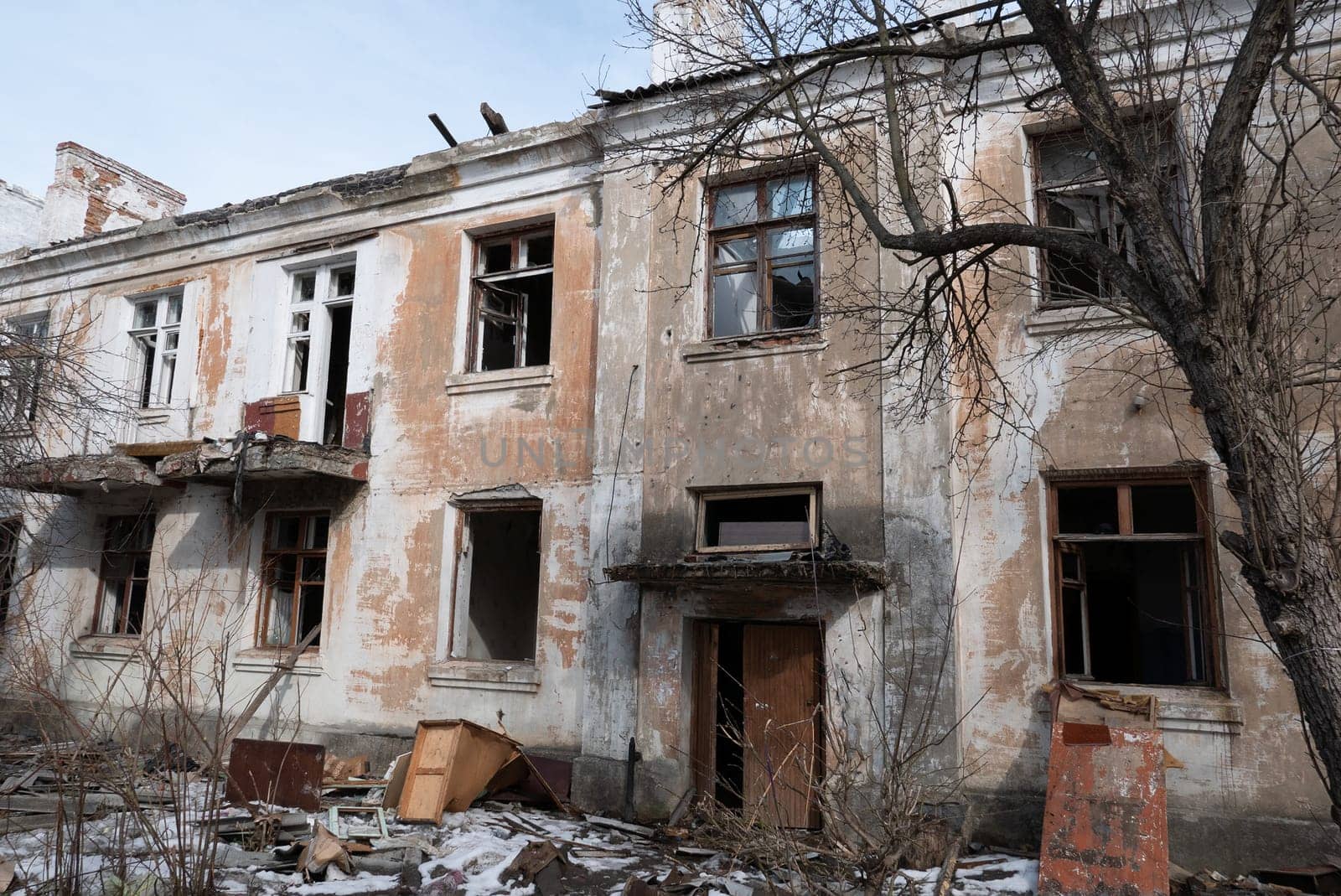 Post-war landscape. Destroyed building. War ruins. Destroyed city after the bombing. Dead city. Bombed buildings. Debris buildings. War destruction.