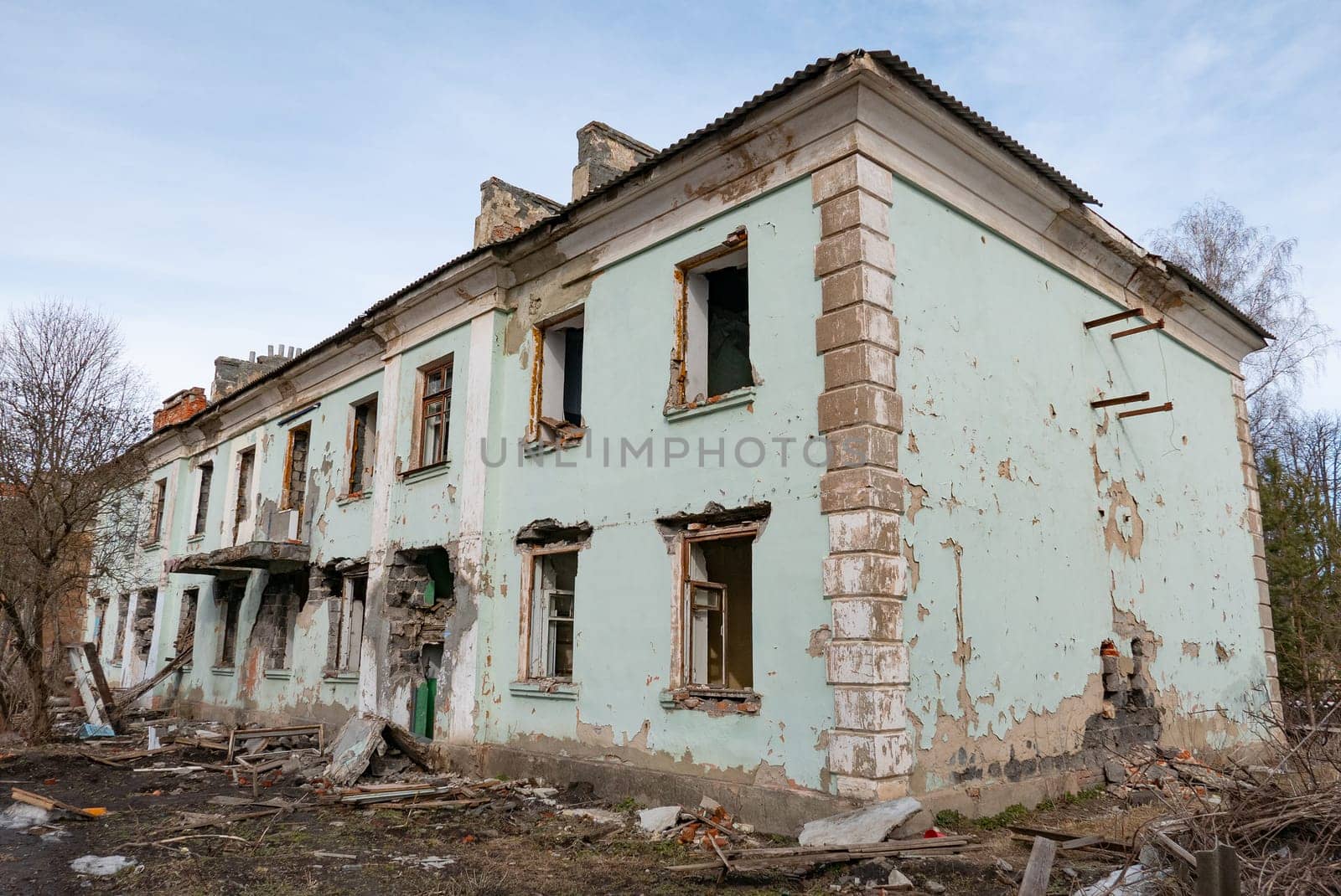 Post-war landscape. Destroyed building. War ruins. Destroyed city after the bombing. Dead city. Bombed buildings. Debris buildings. War destruction.