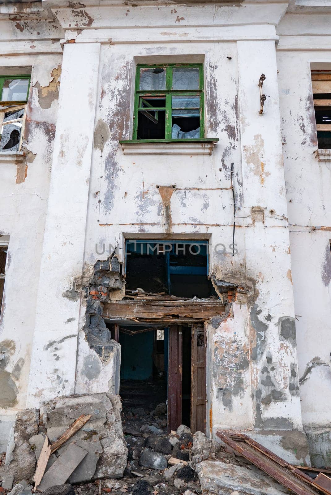 Post-war landscape. Destroyed building. War ruins. Destroyed city after the bombing. Dead city. Bombed buildings. Debris buildings. War destruction.